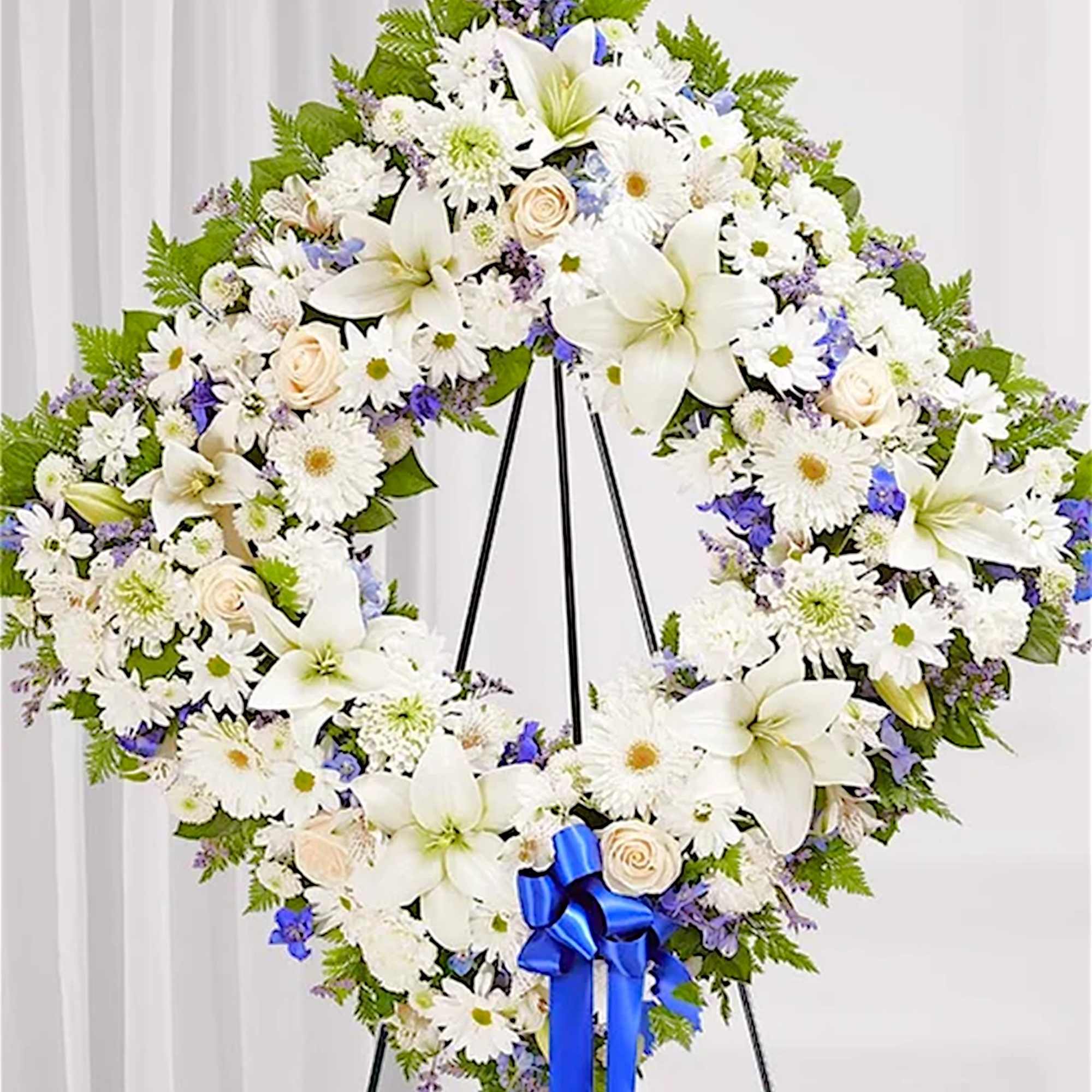 Offer solace with a sentimental arrangement for the services. The square wreath