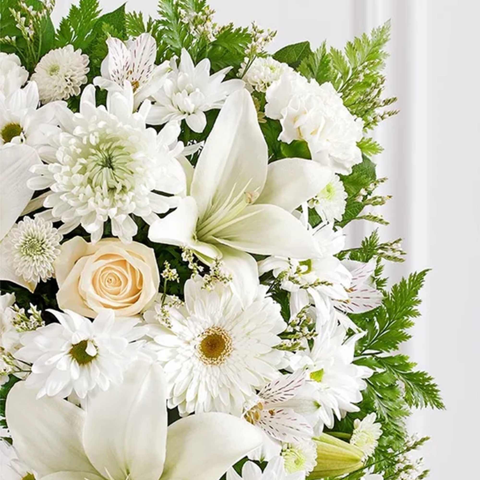 Offer solace with a sentimental arrangement for the services. The square wreath