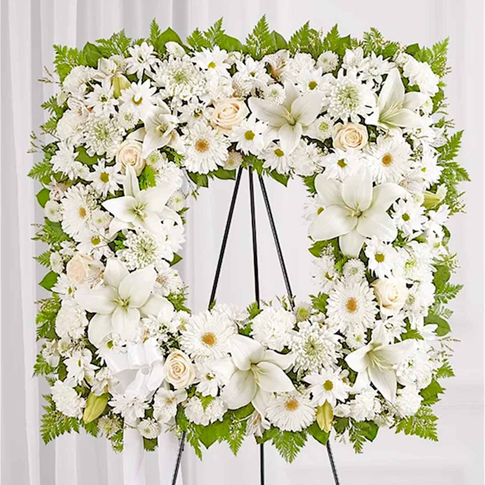 Offer solace with a sentimental arrangement for the services. The square wreath