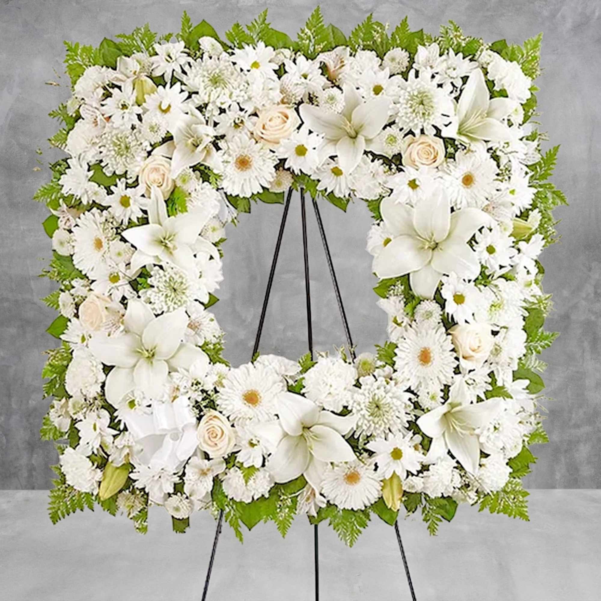 Offer solace with a sentimental arrangement for the services. The square wreath