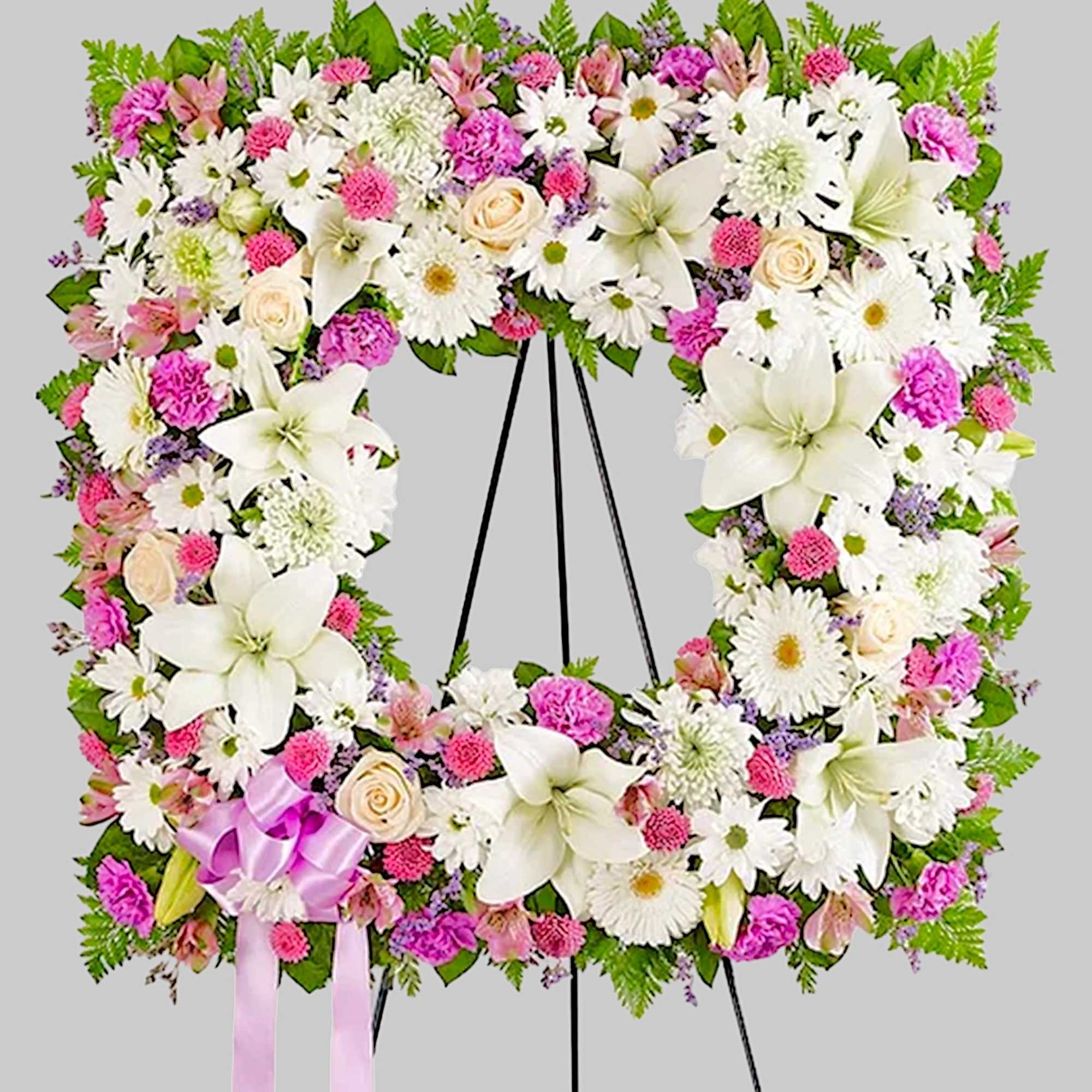 Offer solace with a sentimental arrangement for the services. The square wreath
