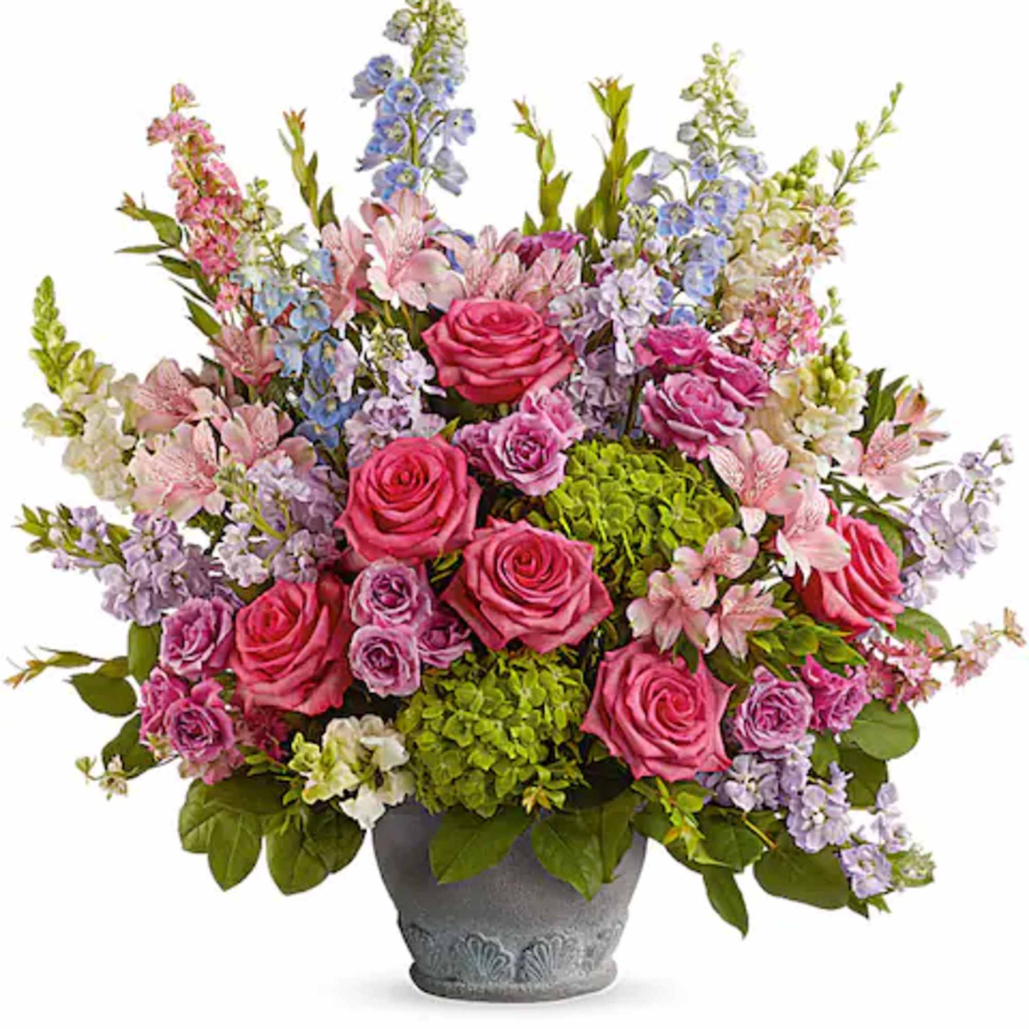 This arrangement features green hydrangea, hot pink roses, lavender spray roses, light