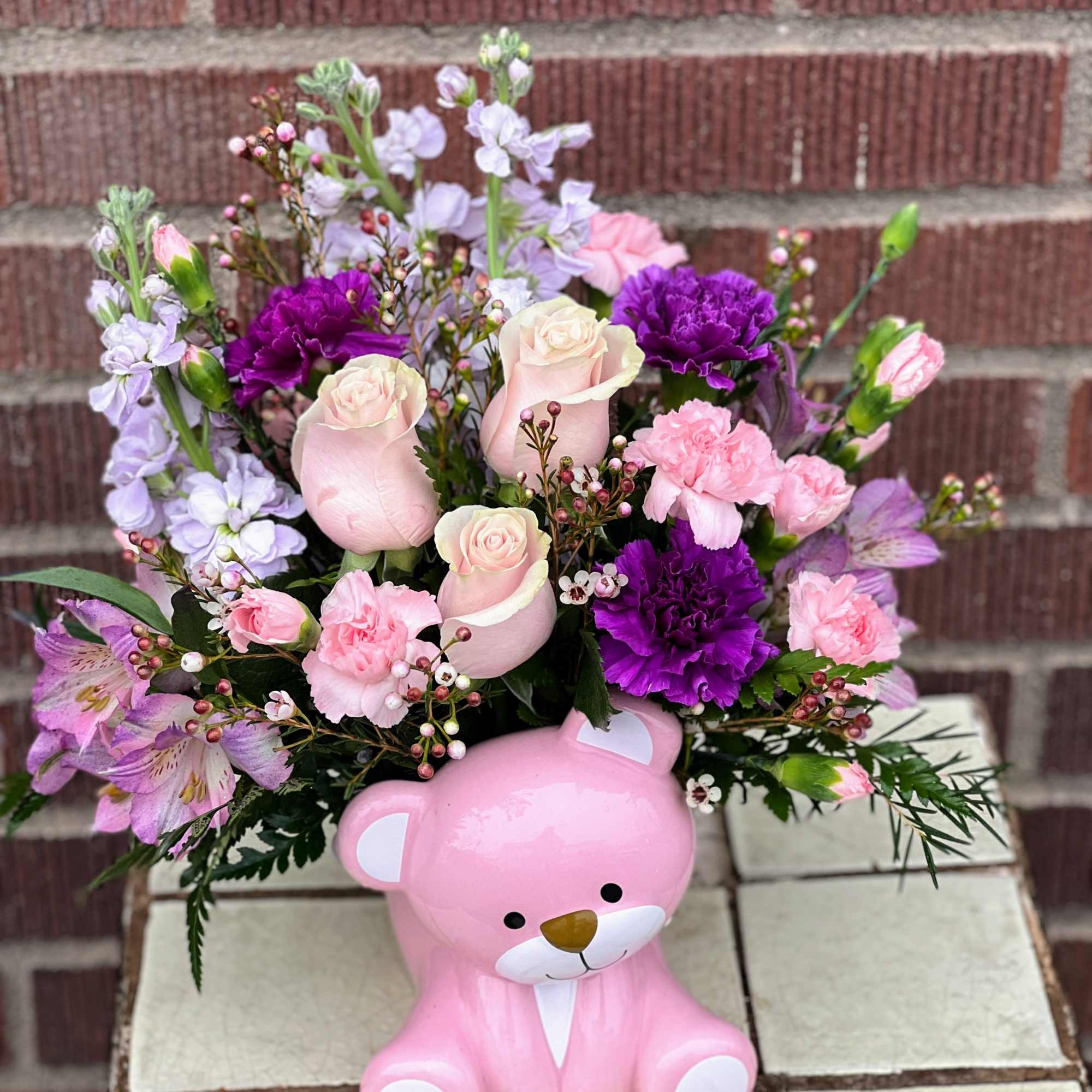 Congratulate the new parents with this sweet bouquet of pink roses and Congratulate the new parents with this sweet bouquet of pink roses and