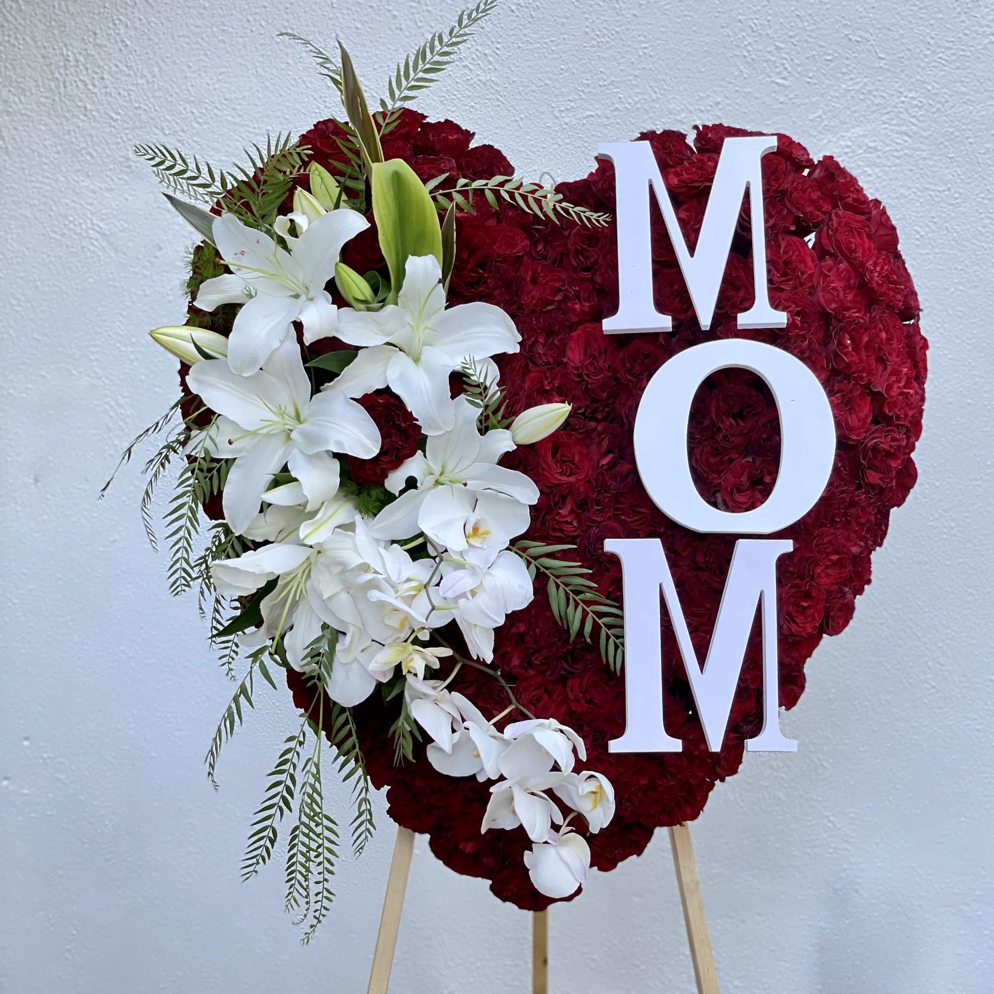 Covered in red roses, this full heart can also includes letters of