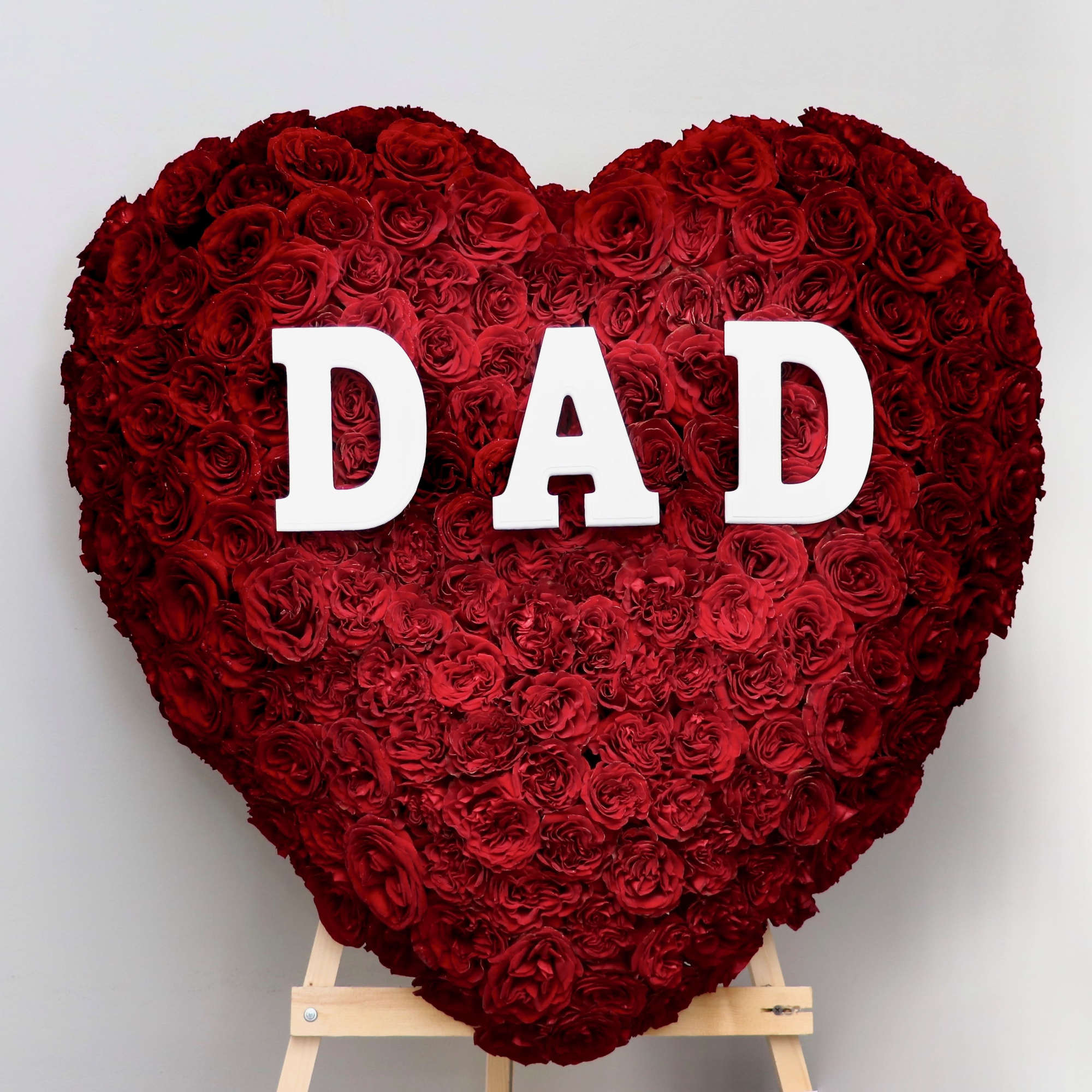 Covered in red roses, this full heart can also includes letters of