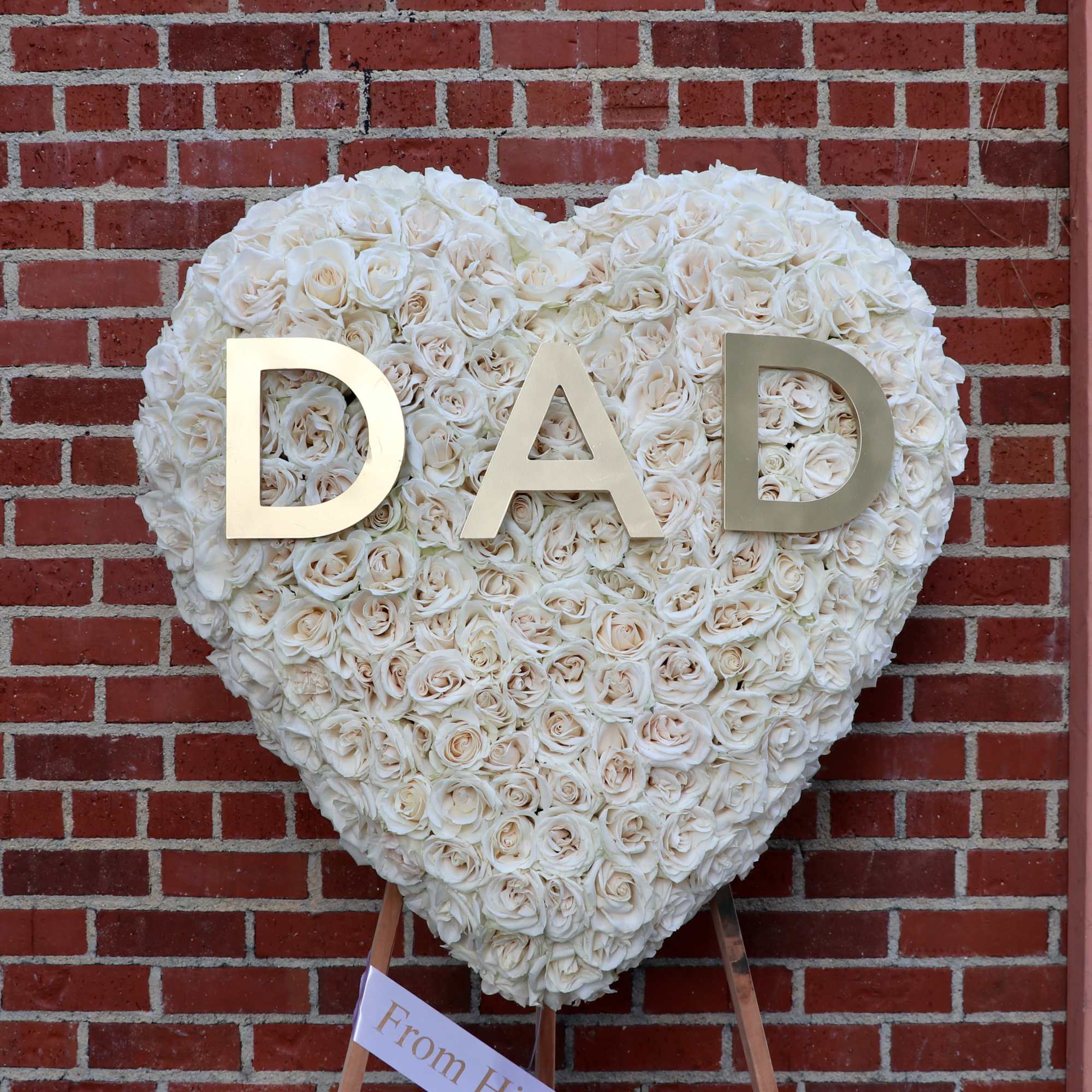 Covered in red roses, this full heart can also includes letters of