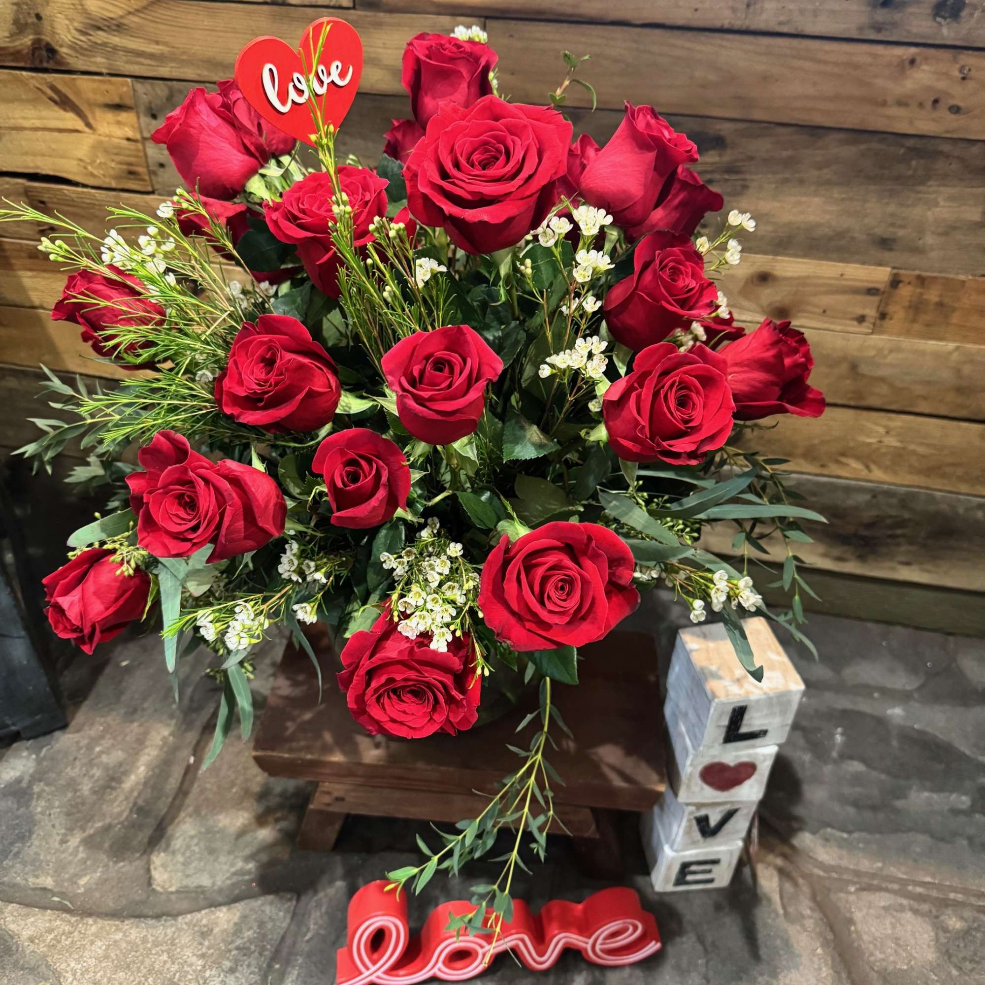 Gorgeous 2 dozen Ecuadorian red roses with a touch of wax flowers