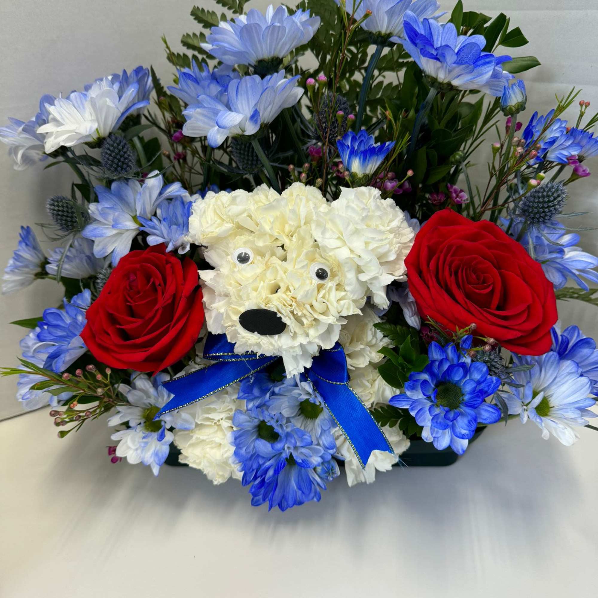  Talk about puppy love! Crafted from lasting white carnations, our canine