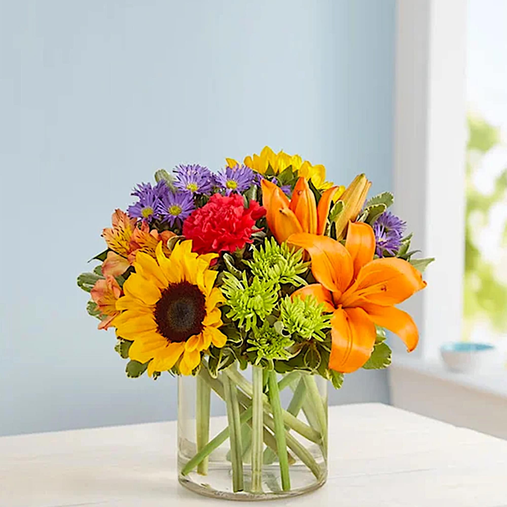 Like a comforting embrace, the vibrant arrangement expresses your warm condolences beautifully;