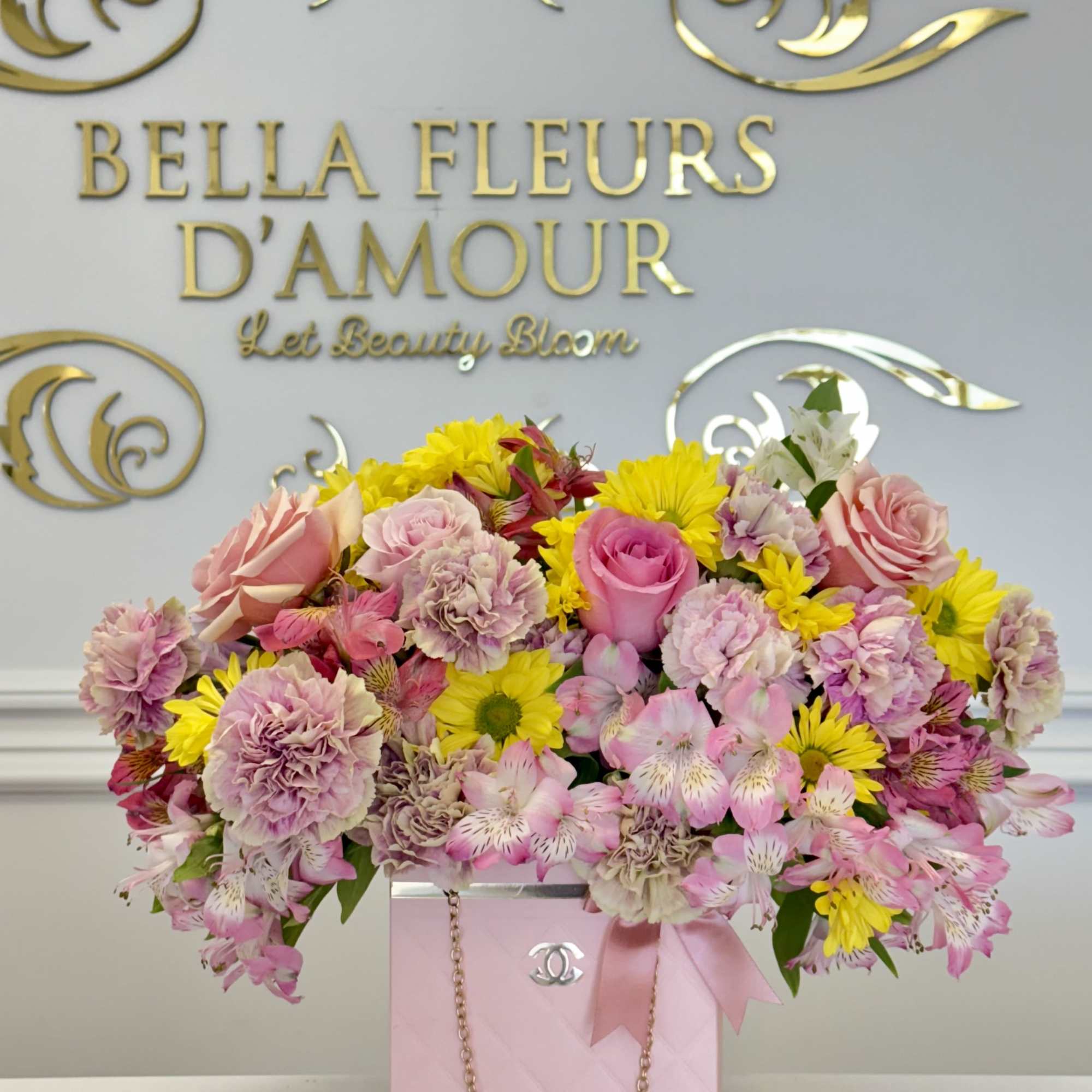 A beautiful mix of designers choice florals elegantly designed in out chic