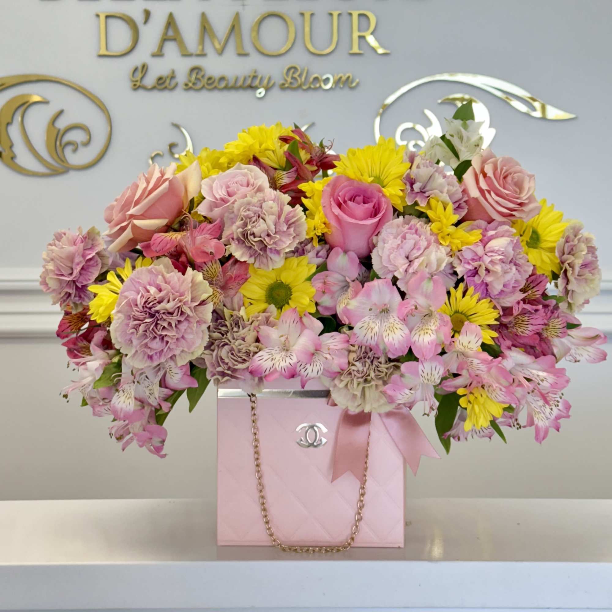 A beautiful mix of designers choice florals elegantly designed in out chic