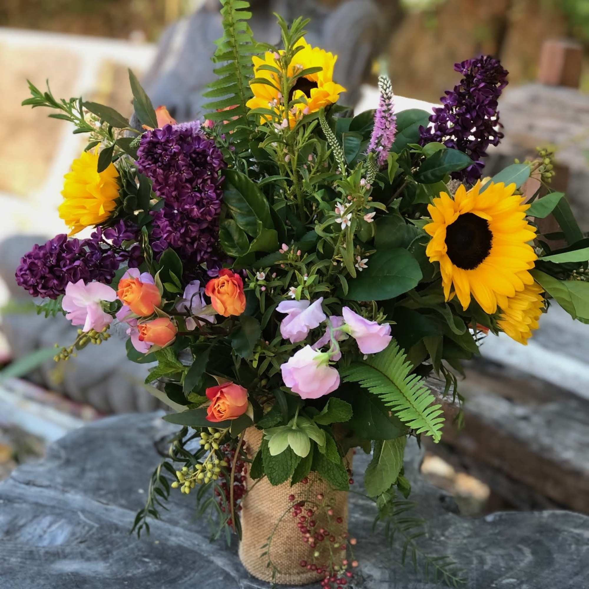 This tall full arrangement offers a bold beautiful mix of color and