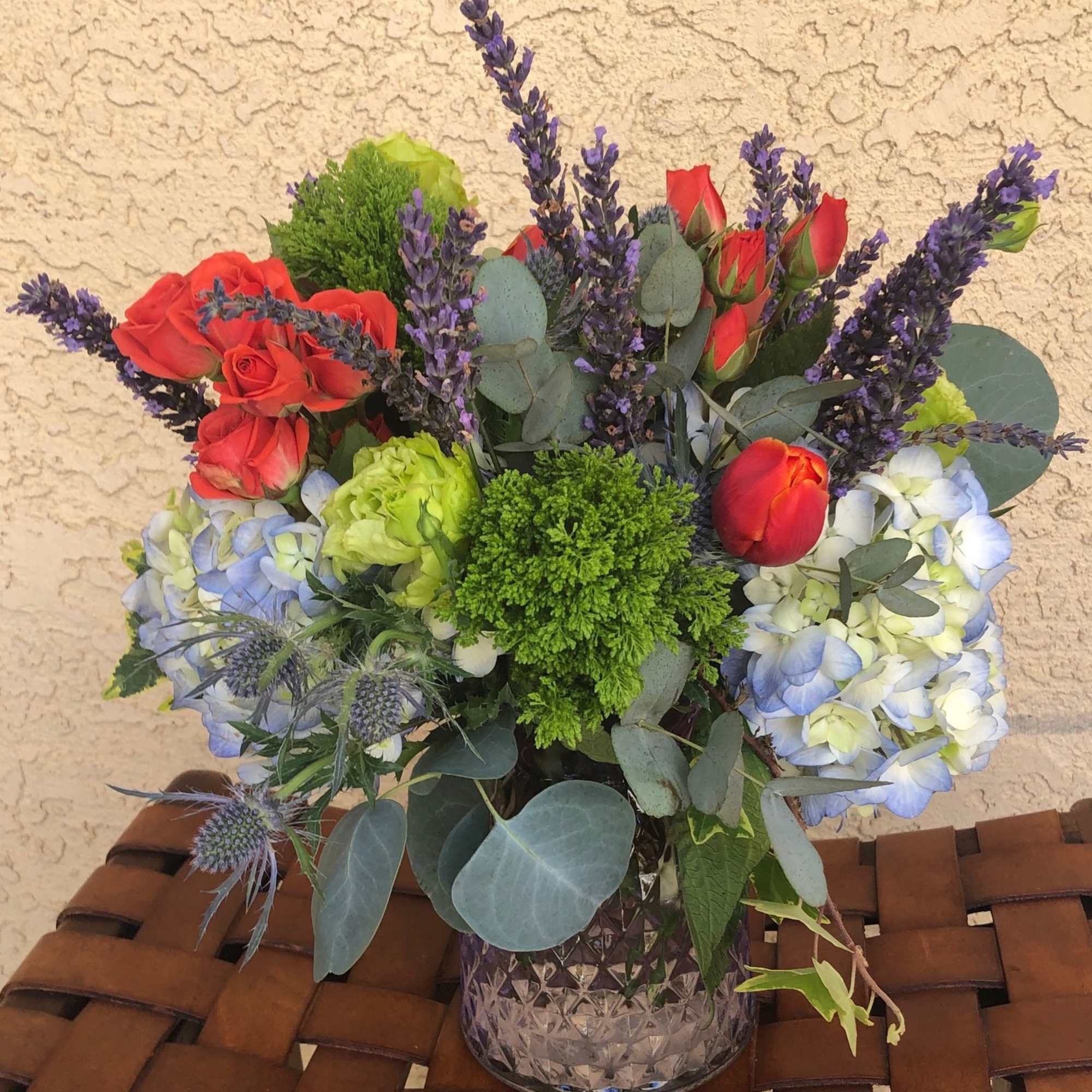 Stunning arrangement of Blue Hydrangea, Vermillion Red Spray Roses and Tulips, Fresh