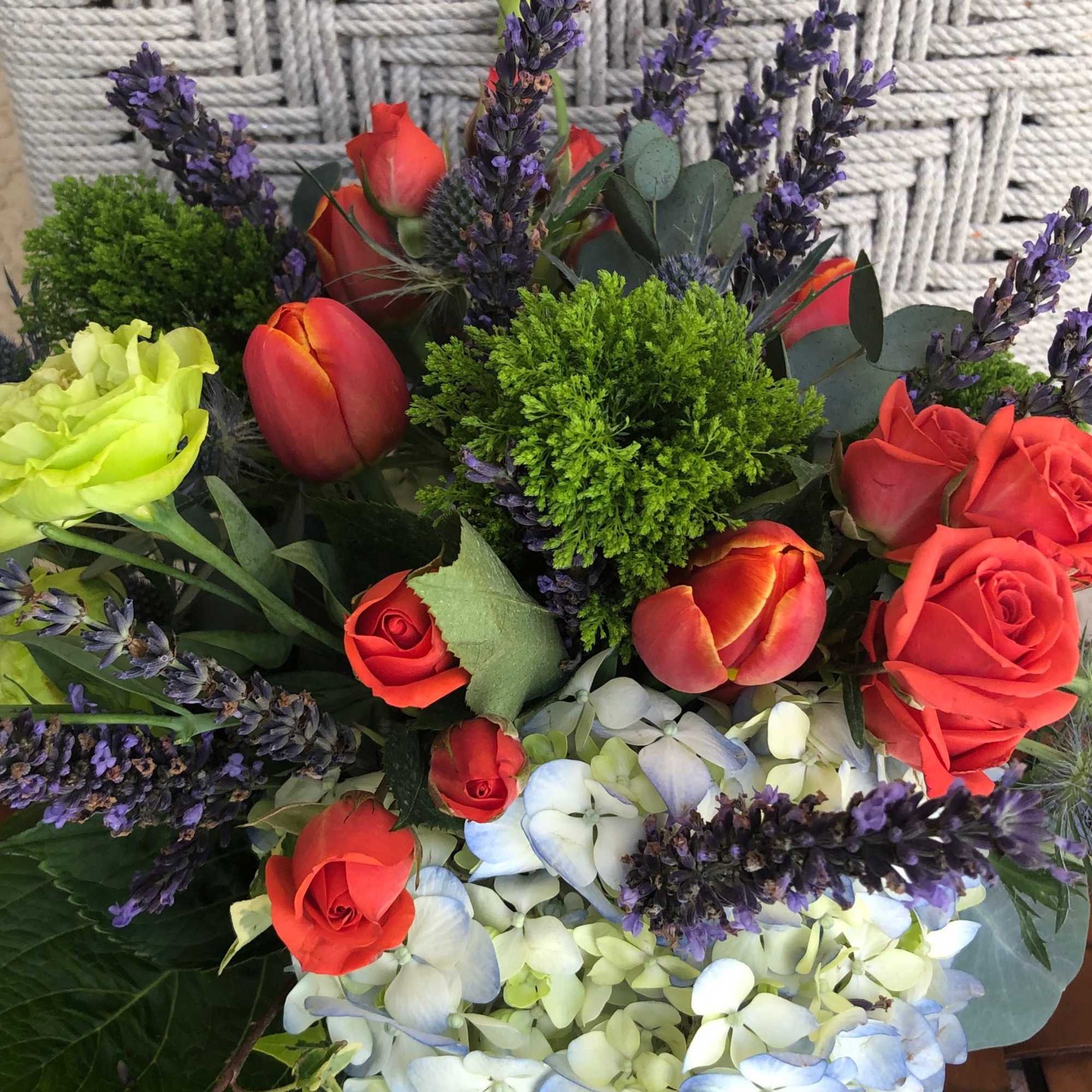 Stunning arrangement of Blue Hydrangea, Vermillion Red Spray Roses and Tulips, Fresh