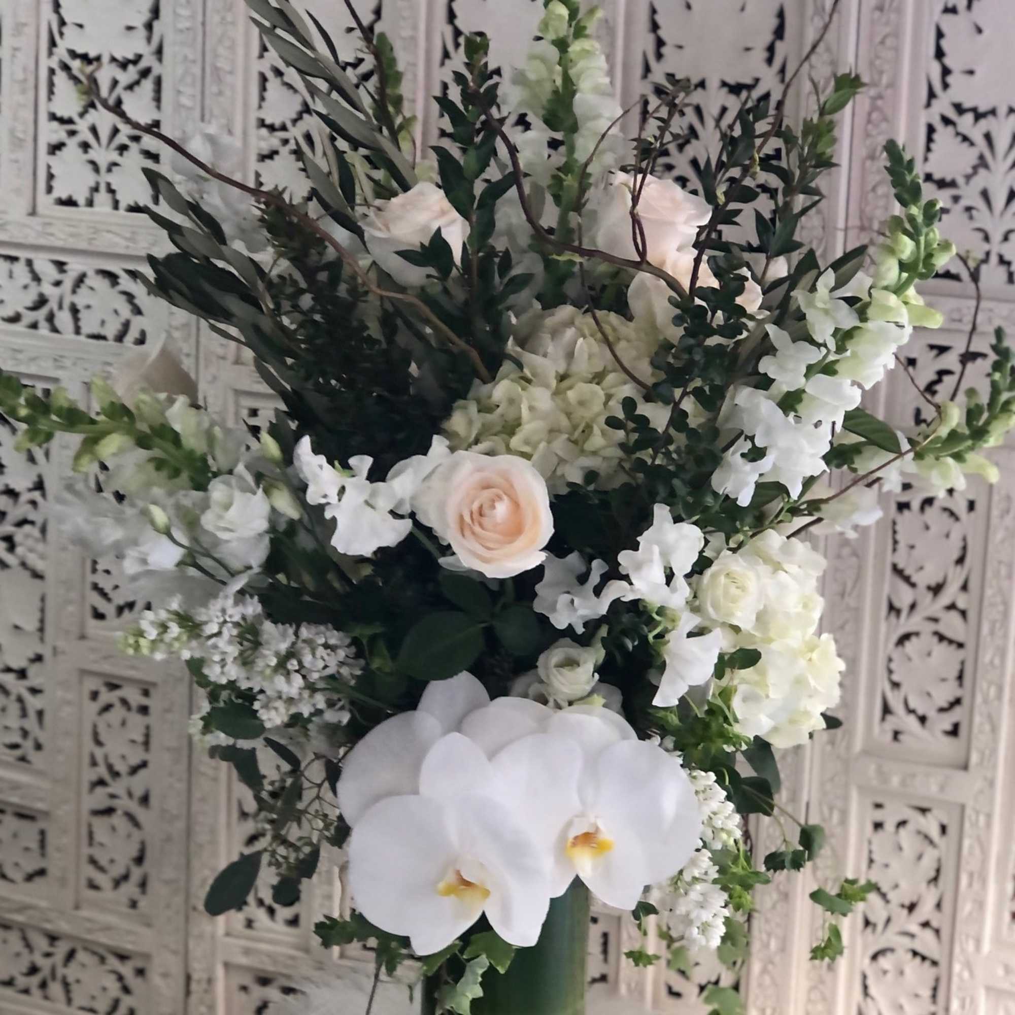 Gorgeous, tall arrangement with an assortment of white and cream garden flowers