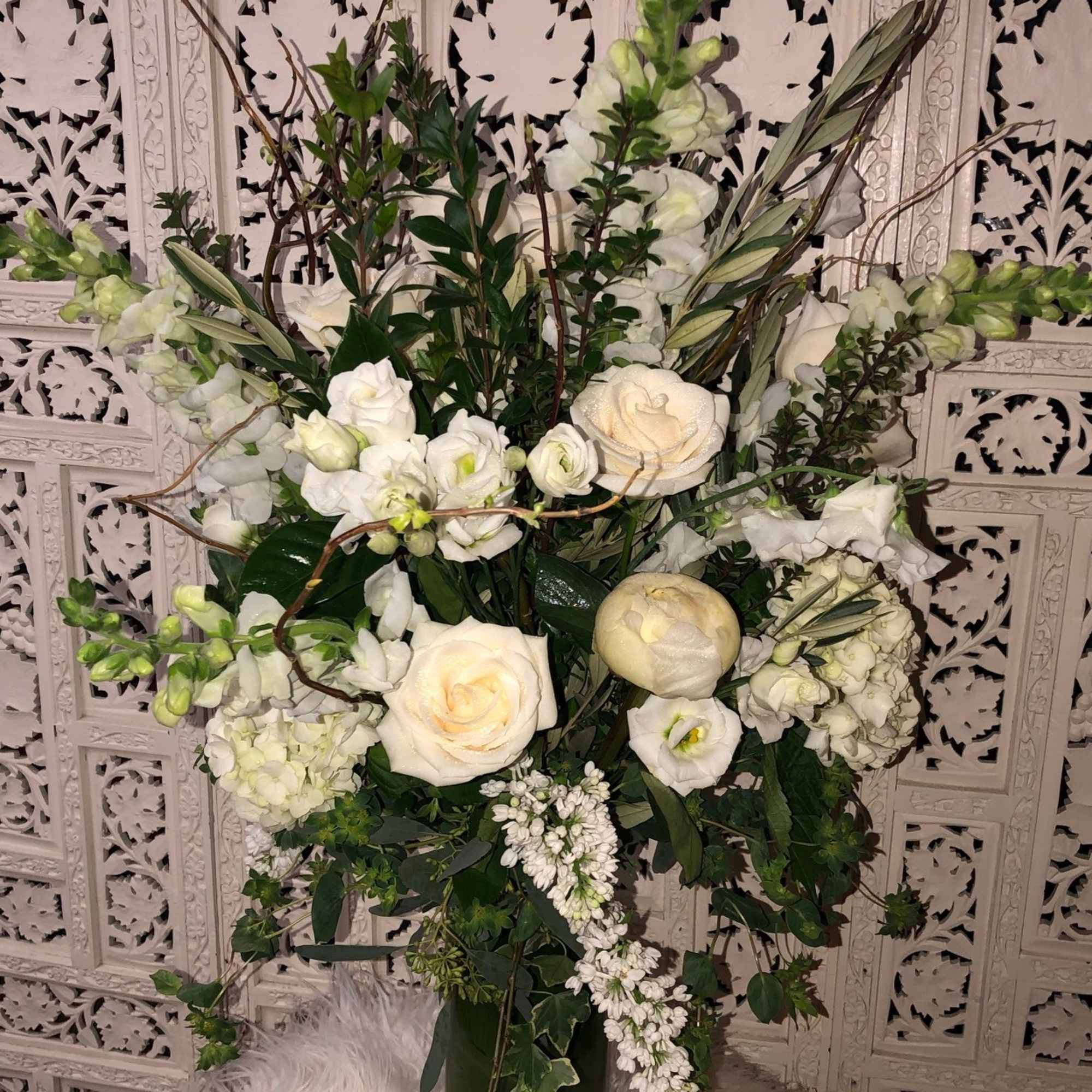 Gorgeous, tall arrangement with an assortment of white and cream garden flowers