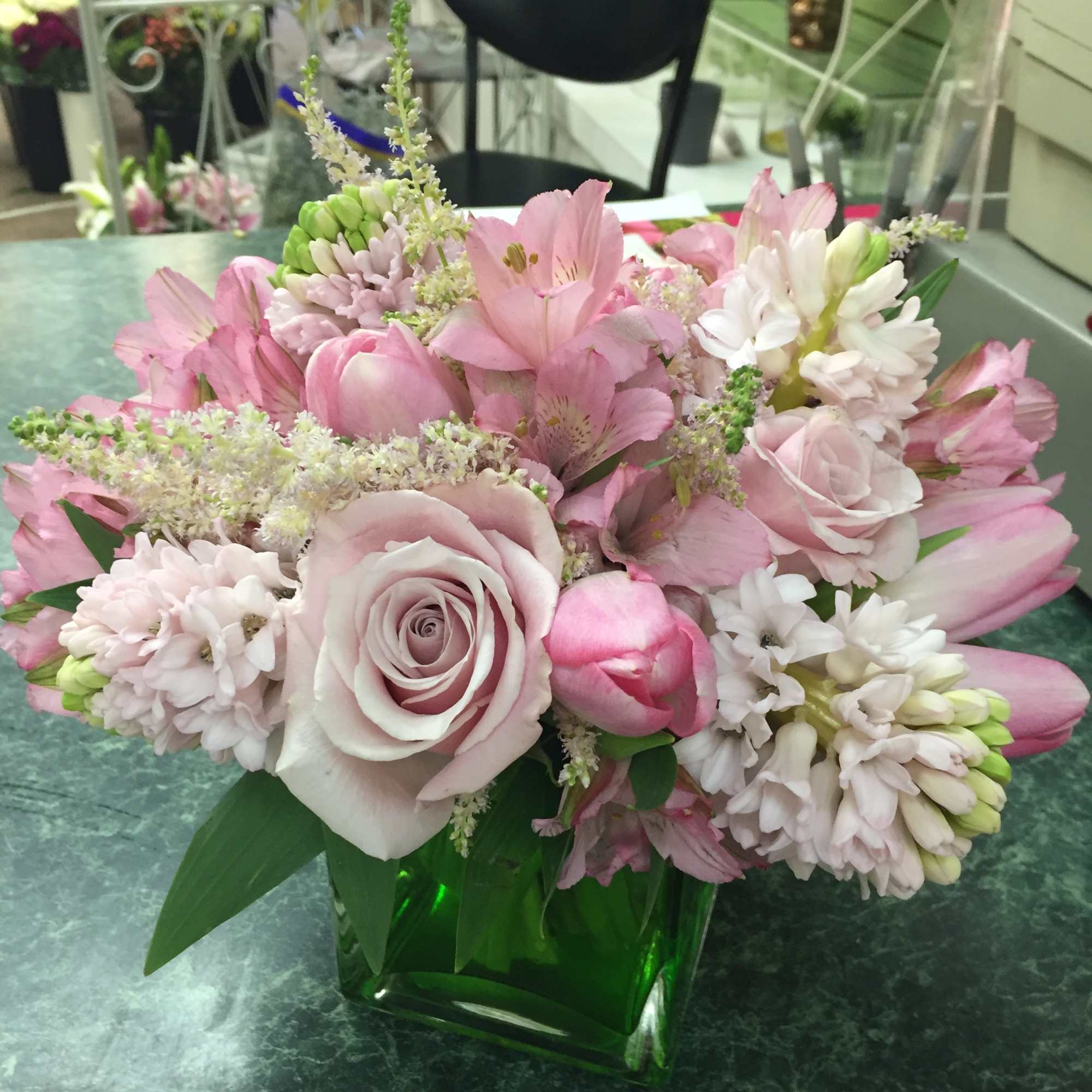 Classic cube with a variety of pink flowers. Selection varies with the