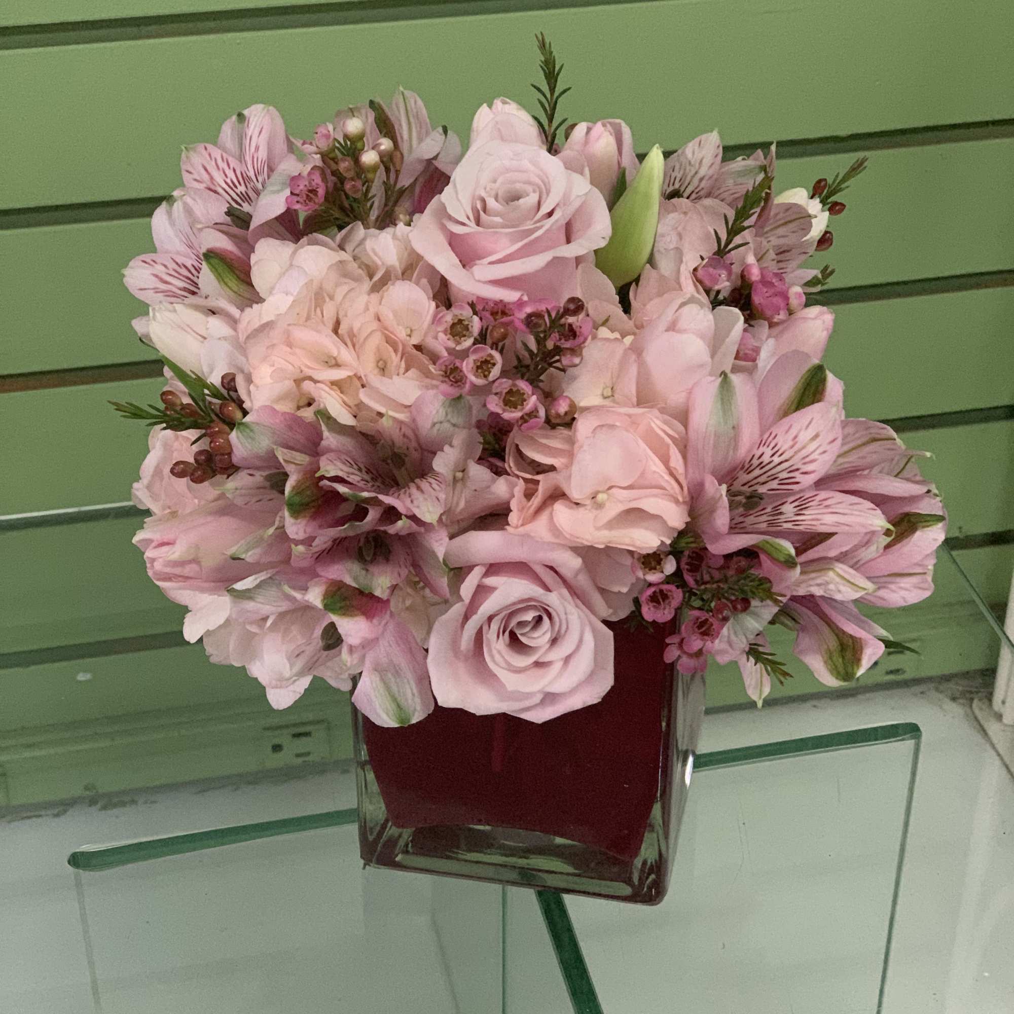 Classic cube with a variety of pink flowers. Selection varies with the