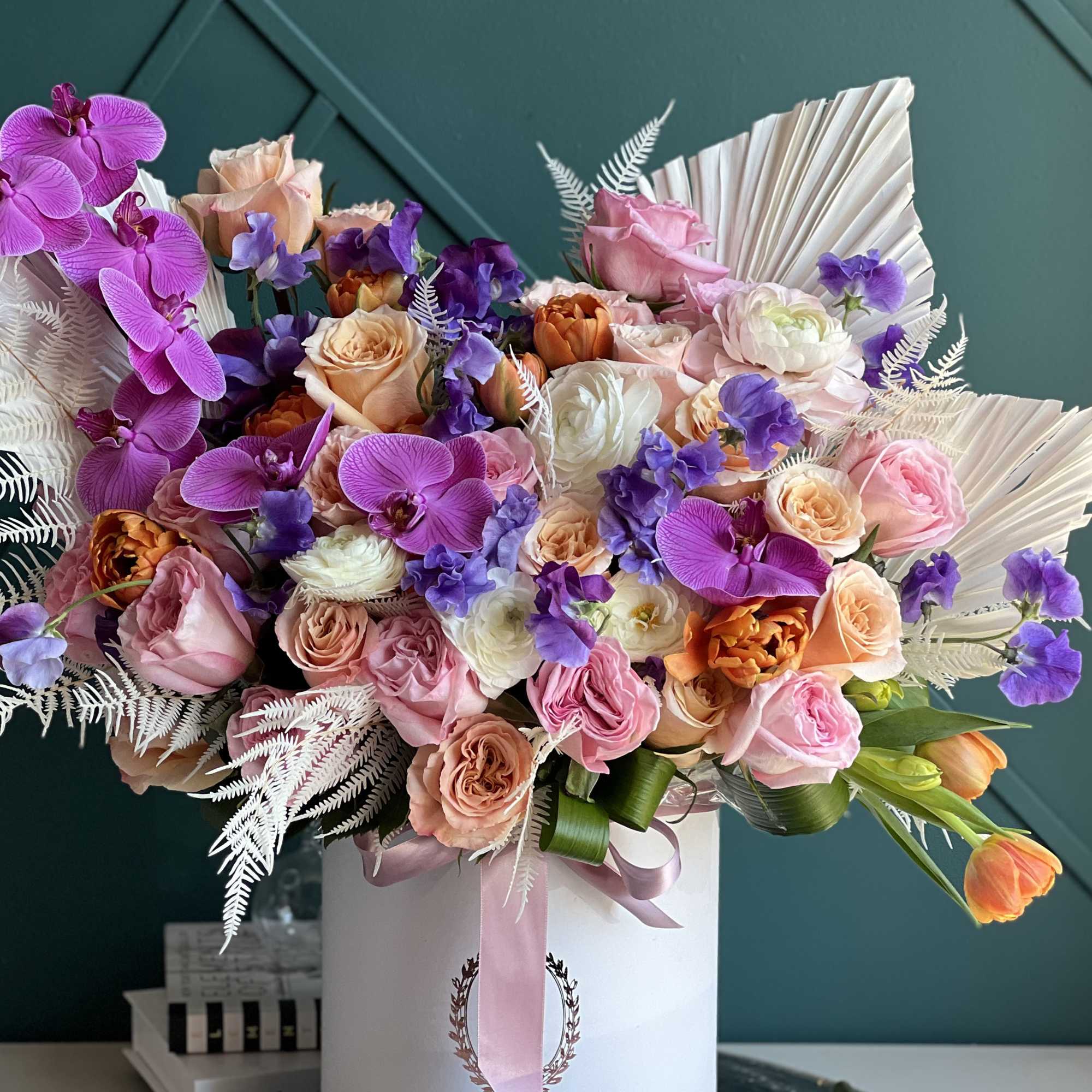 Luxurious arrangement full with flowers.

Includes roses, garden roses, tulips, ranunculus, phalaenopsis orchids