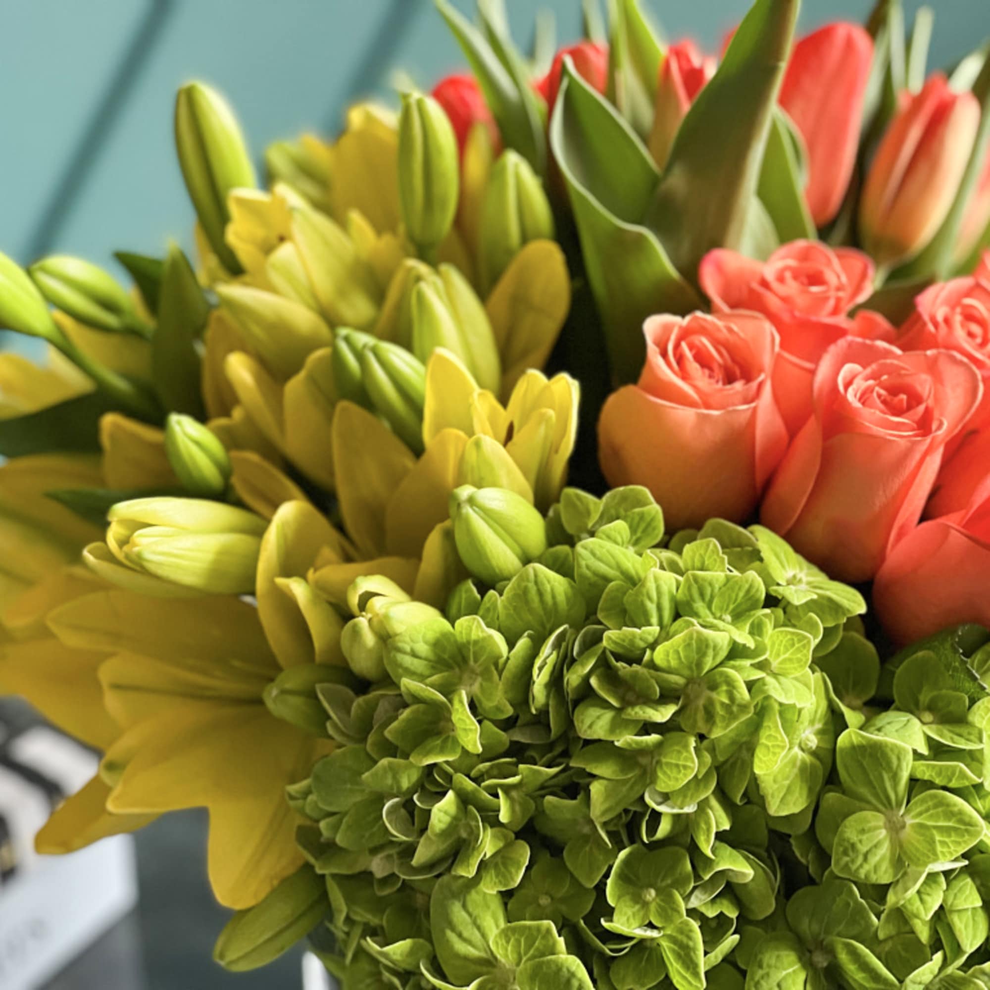 Bright sunny design with full of flowers, true orange roses, tulips, yellow