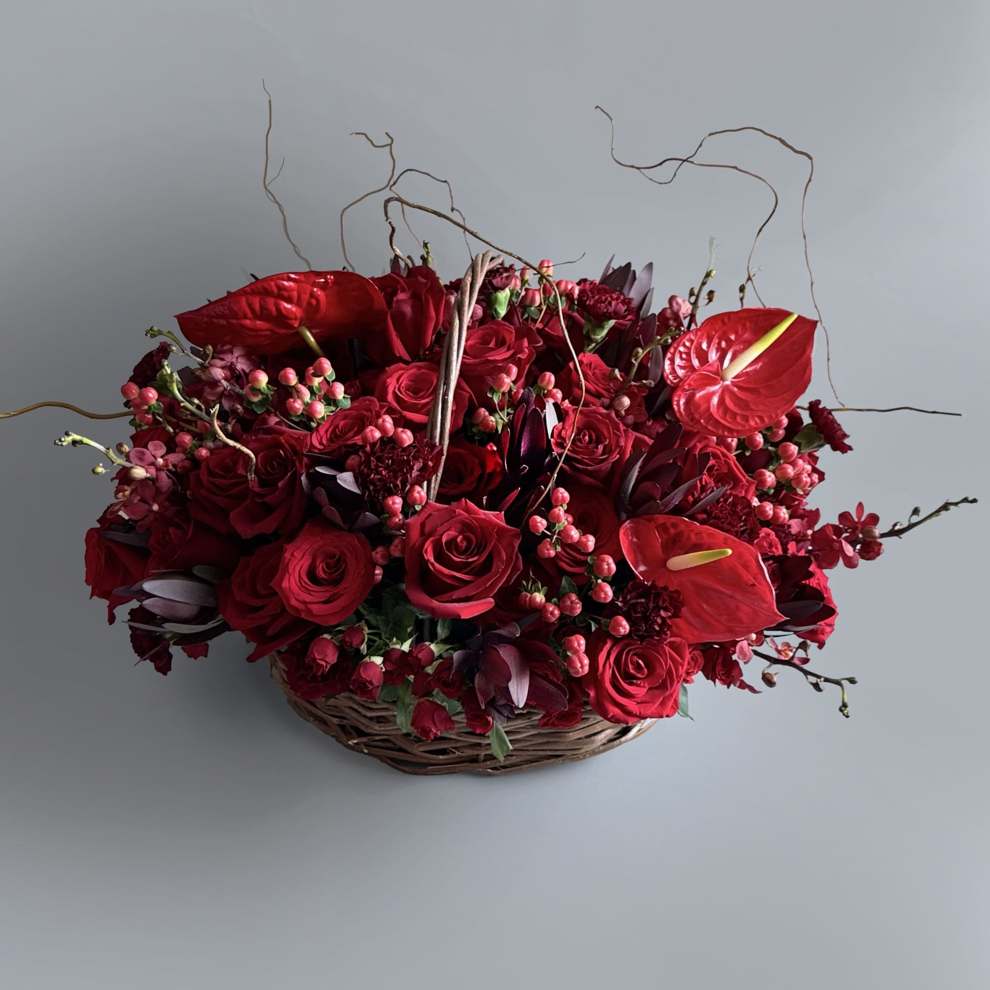 Fall in love with our stunning red flower basket filled with red