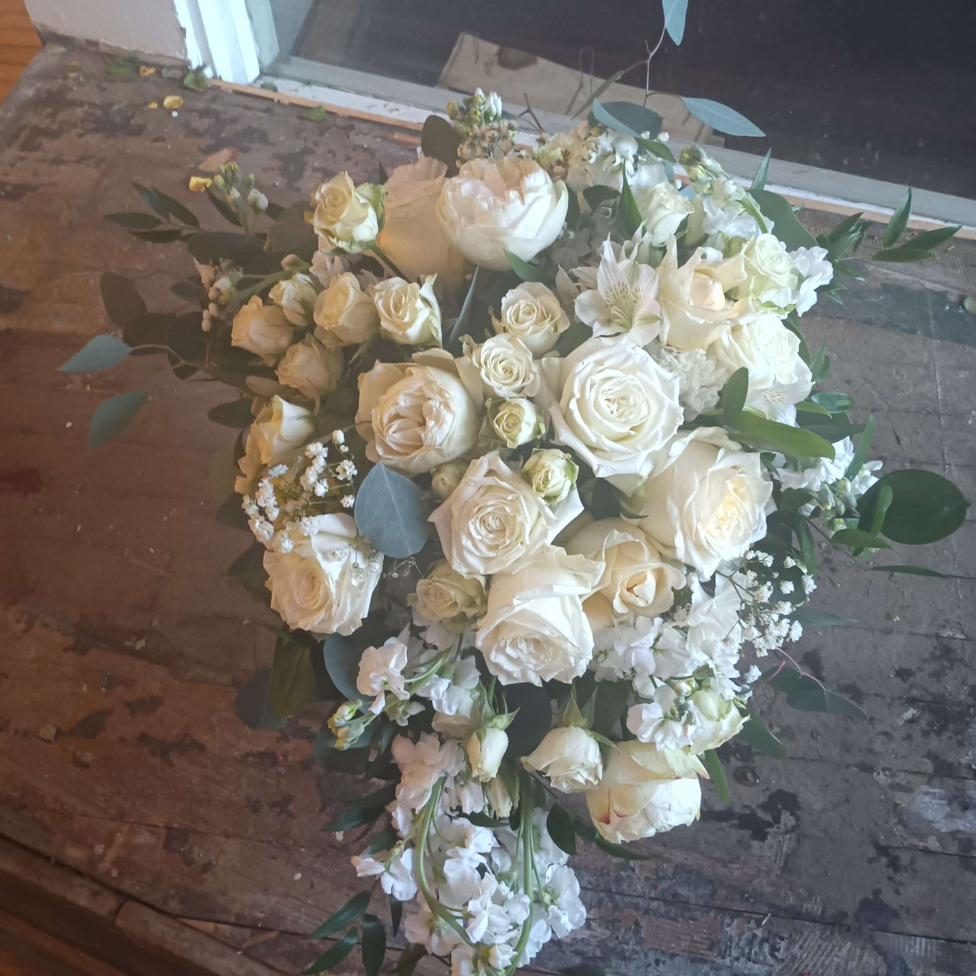 Beautiful vintage white traditional cascade with standard, garden and spray roses, stack