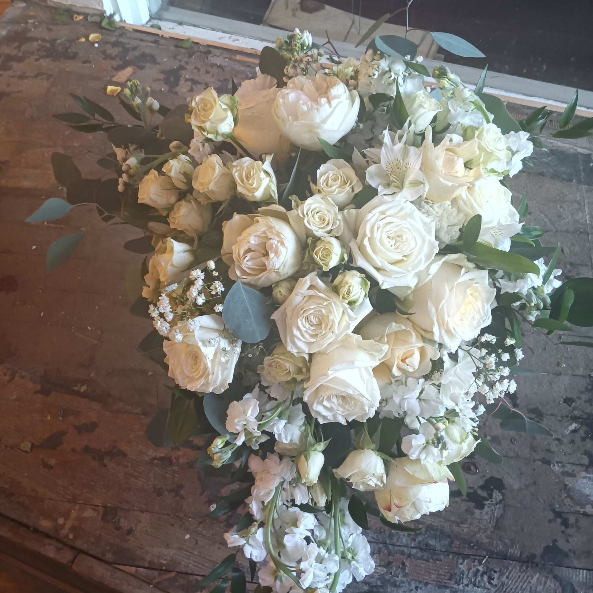 Beautiful vintage white traditional cascade with standard, garden and spray roses, stack