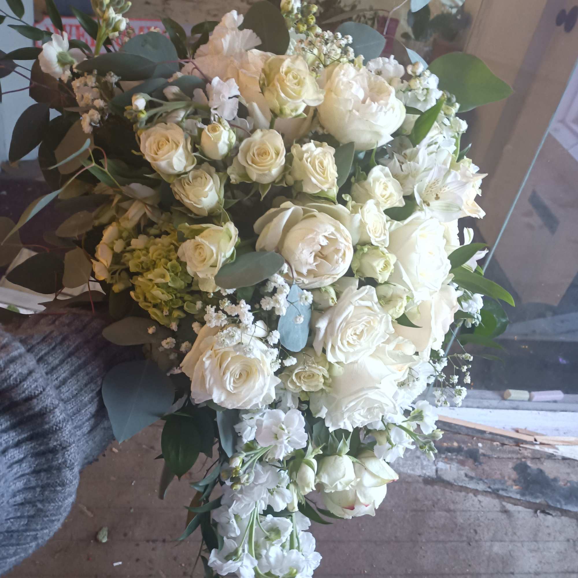 Beautiful vintage white traditional cascade with standard, garden and spray roses, stack