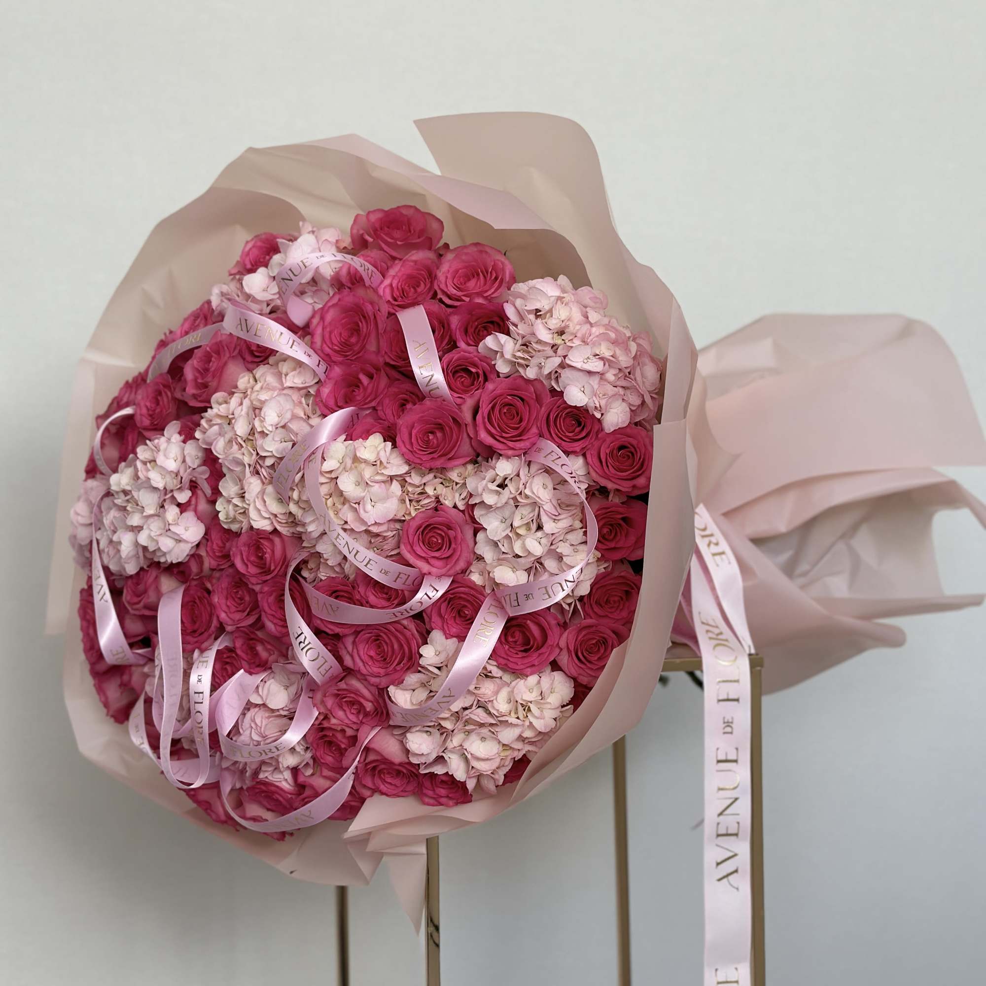 Introducing a stunning arrangement, bursting with soft, romantic blooms. This bouquet is