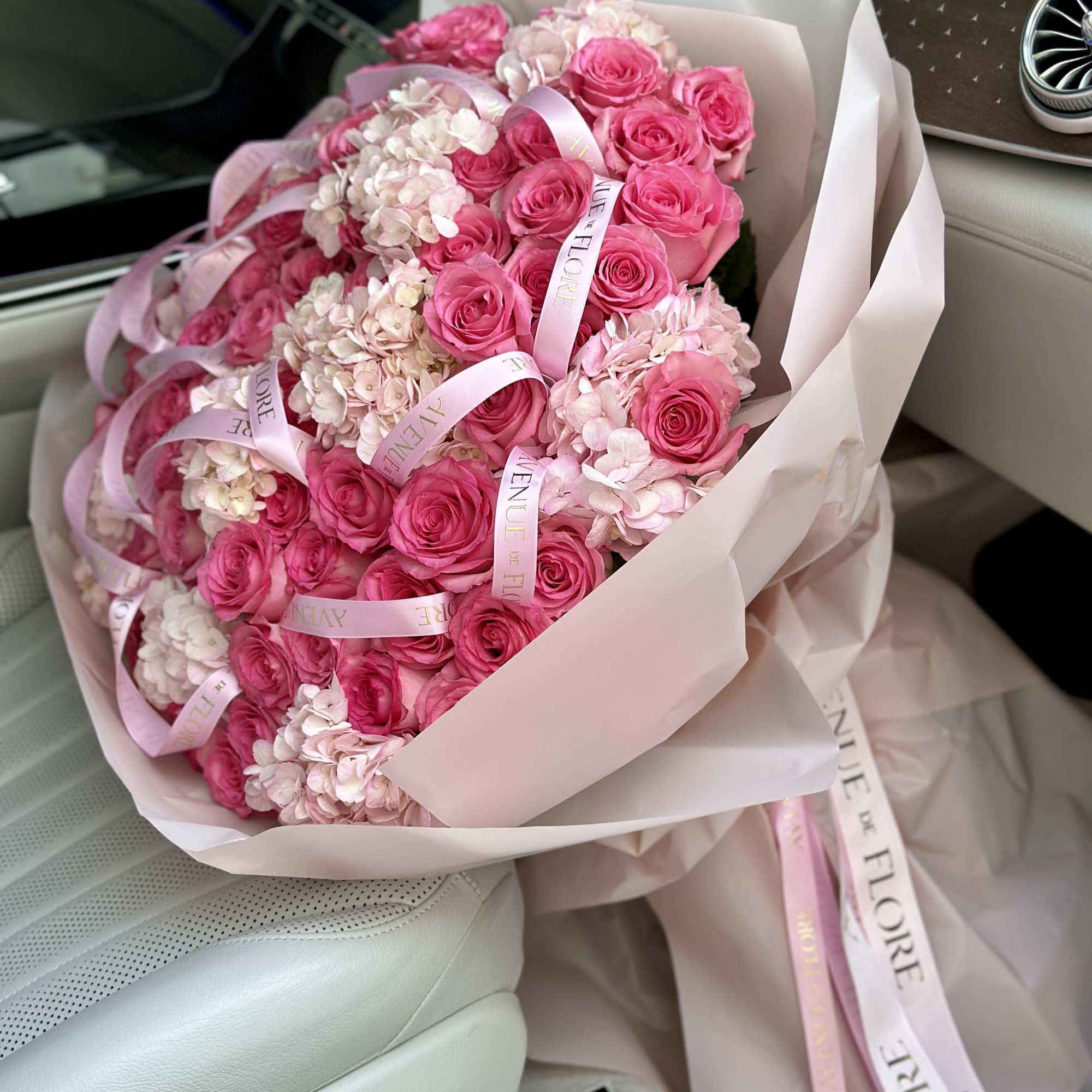 Introducing a stunning arrangement, bursting with soft, romantic blooms. This bouquet is