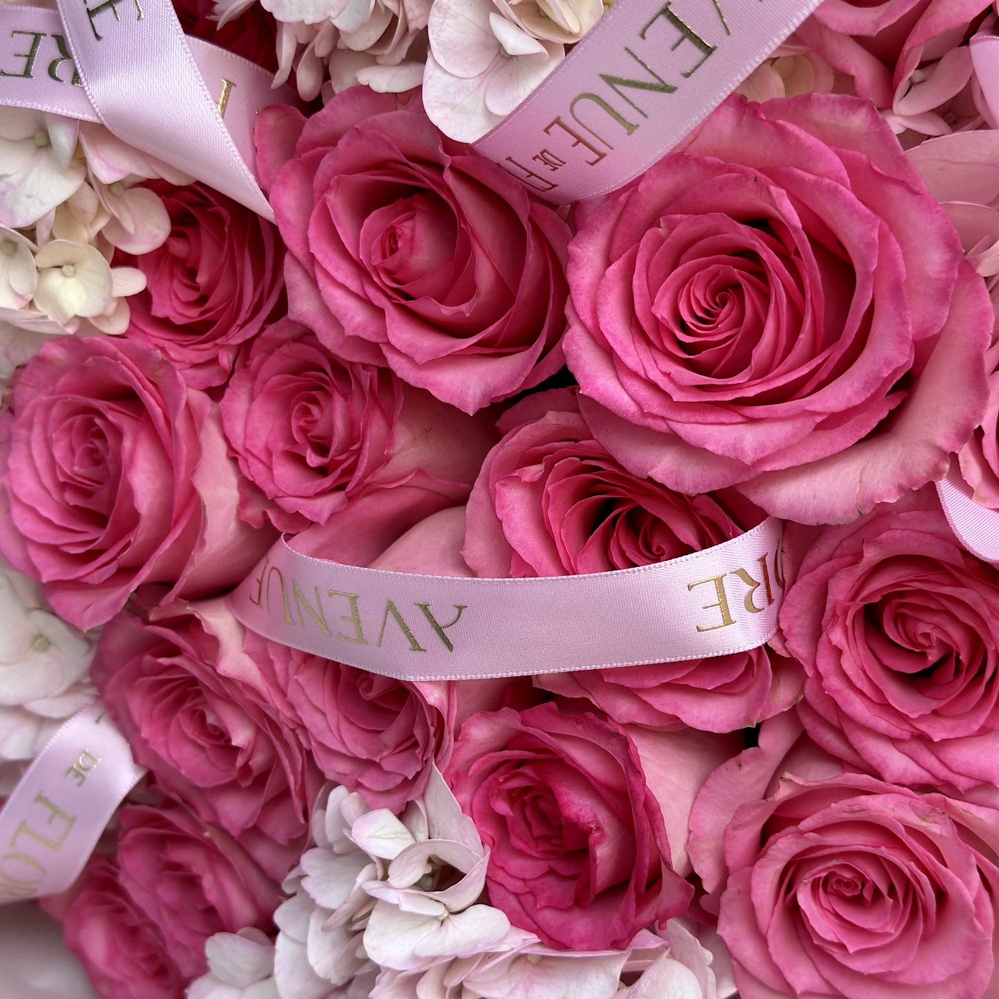 Introducing a stunning arrangement, bursting with soft, romantic blooms. This bouquet is