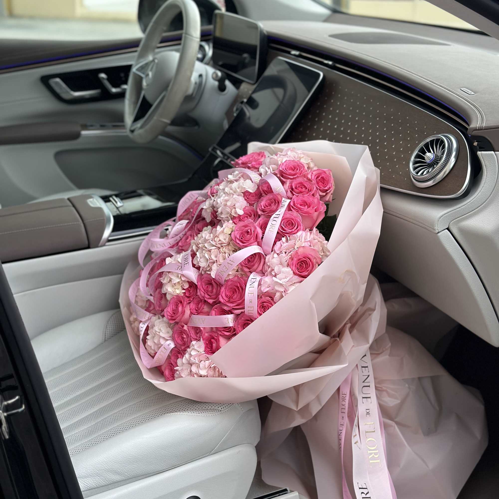 Introducing a stunning arrangement, bursting with soft, romantic blooms. This bouquet is