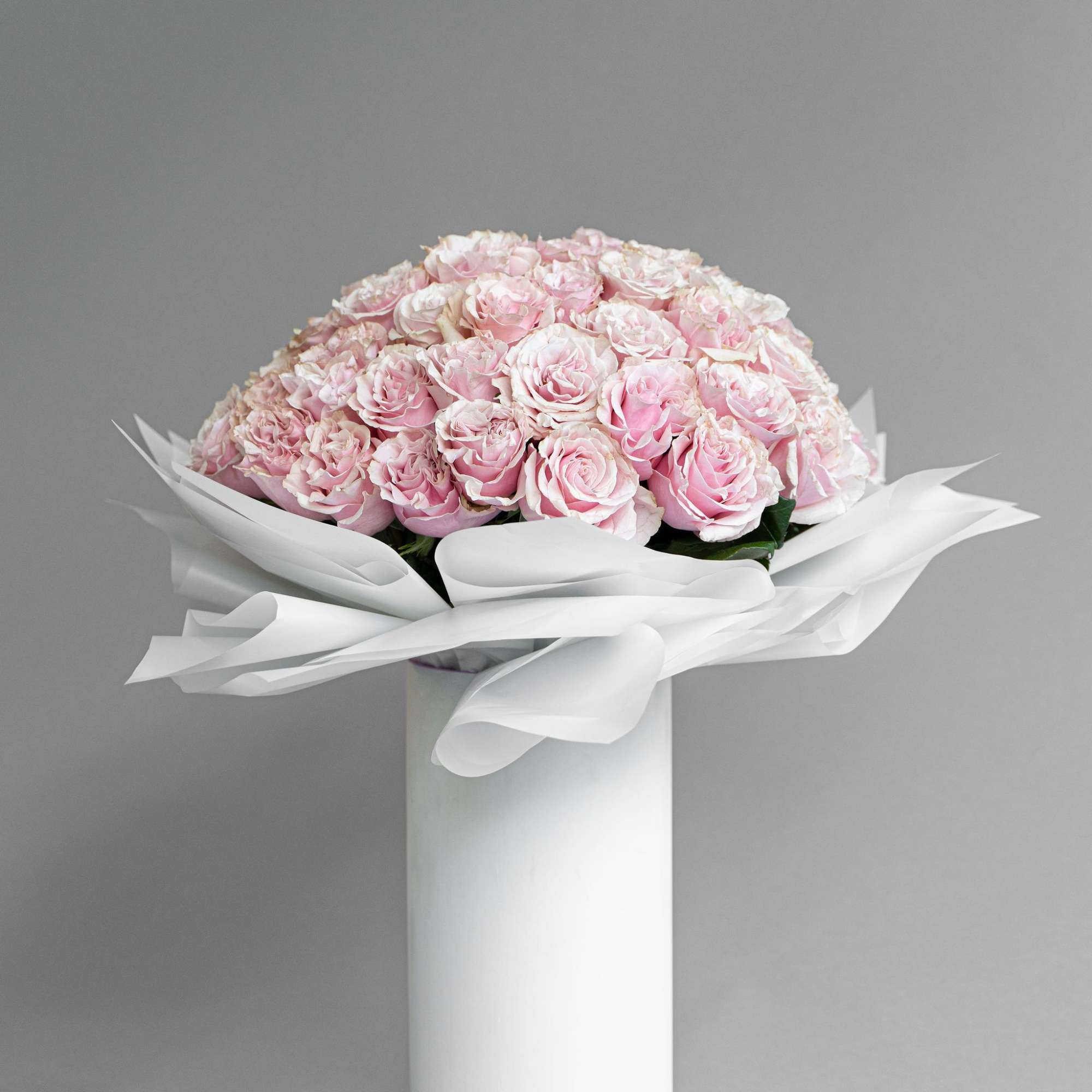 Experience timeless beauty with our preserved rose arrangement, elegantly displayed in a