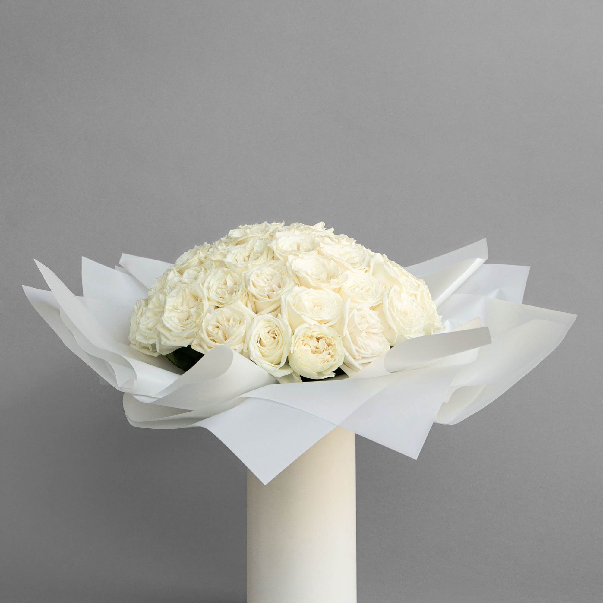 Experience timeless beauty with our preserved rose arrangement, elegantly displayed in a
