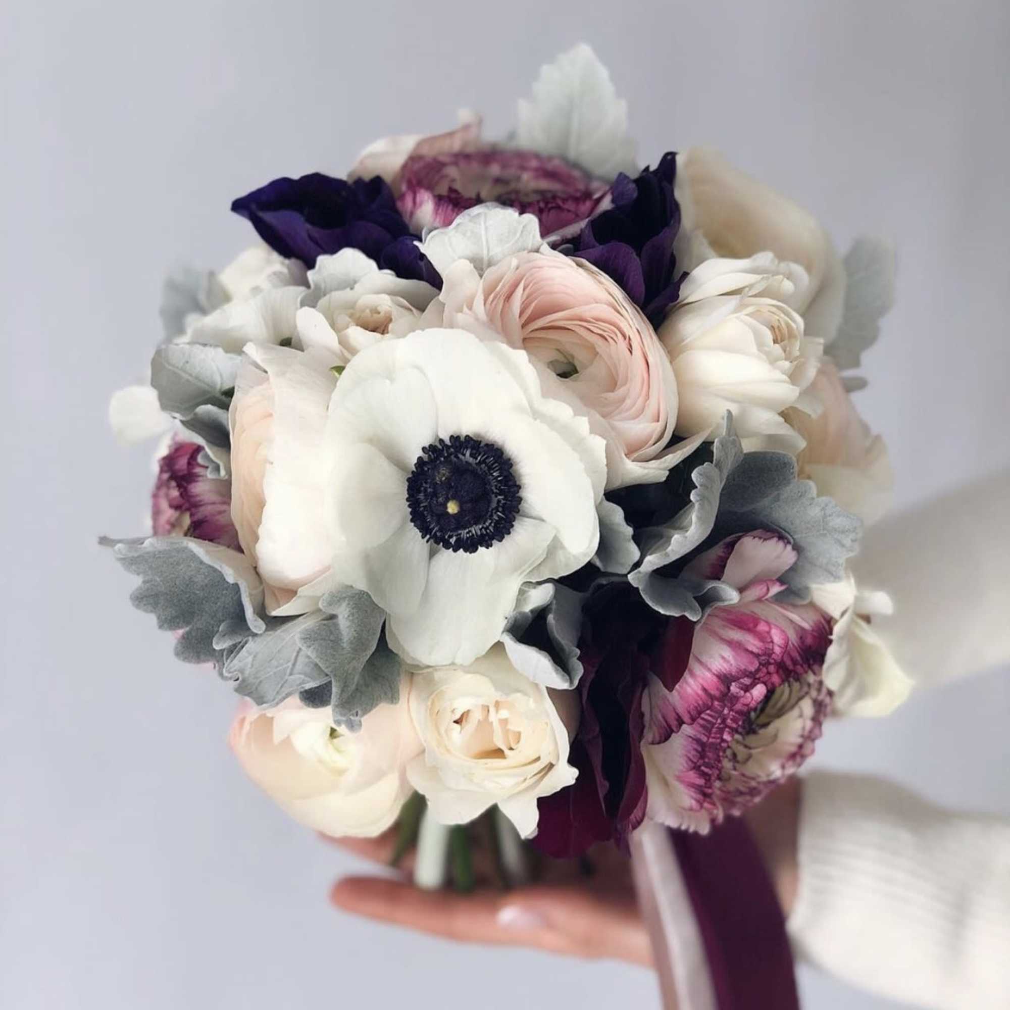 This bridal bouquet is made in a classic round shape from delicate