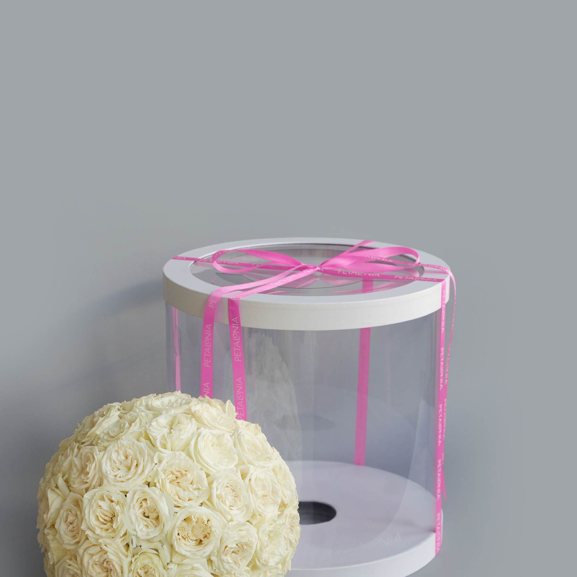 A gift and flowers in one, this exquisite spherical arrangement of mini