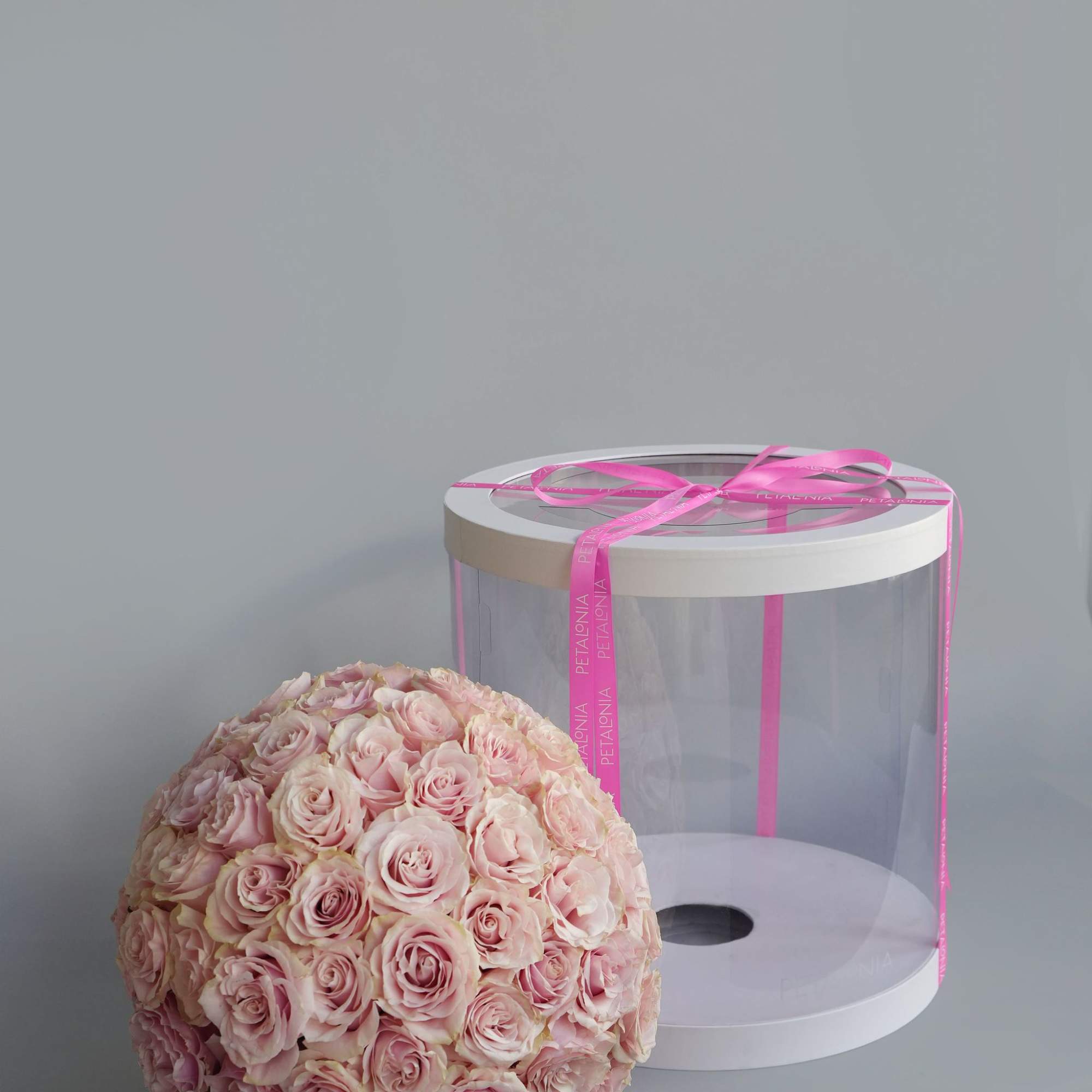 A gift and flowers in one, this exquisite spherical arrangement of mini