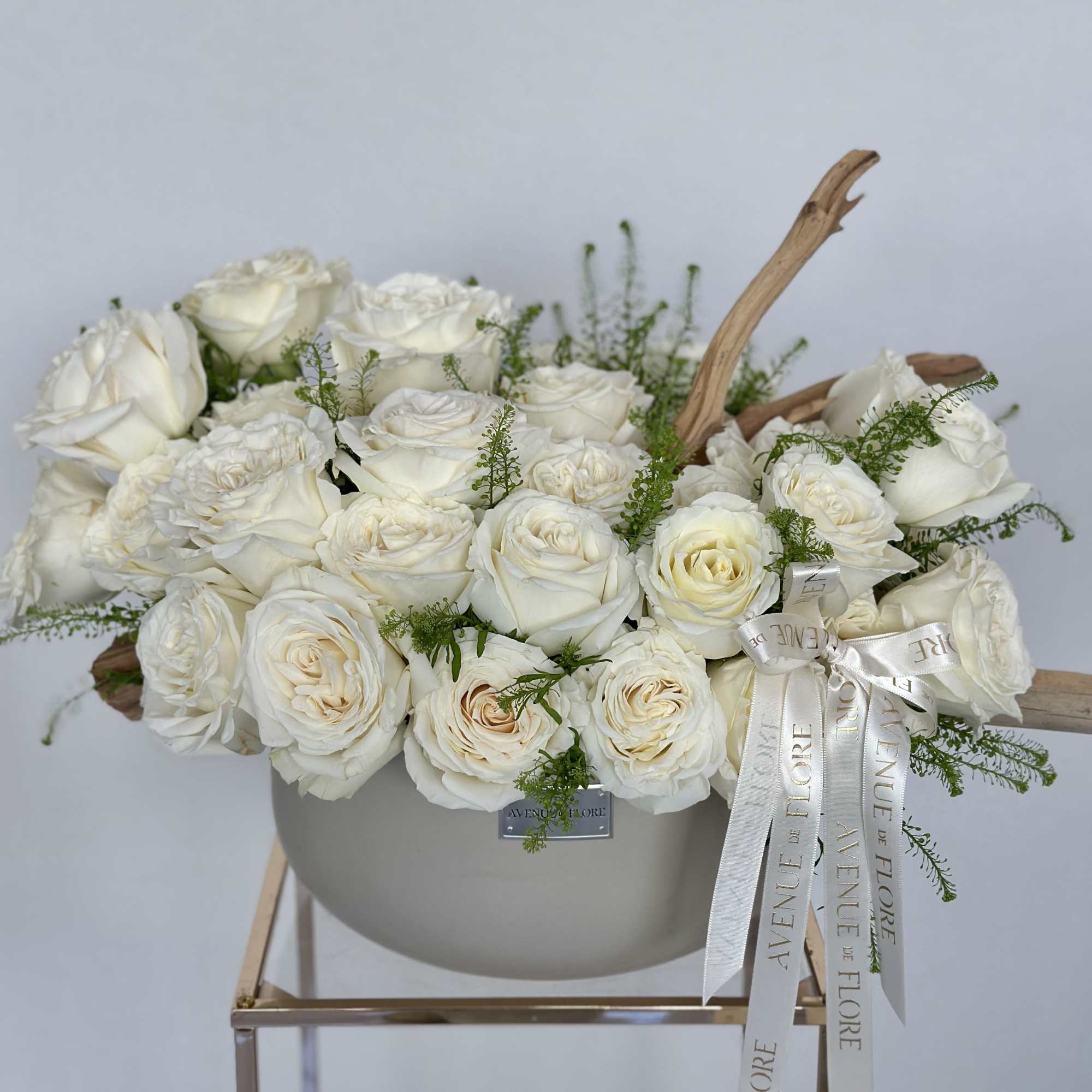 A serene and elegant arrangement delicately nestled in a sophisticated chic vase.