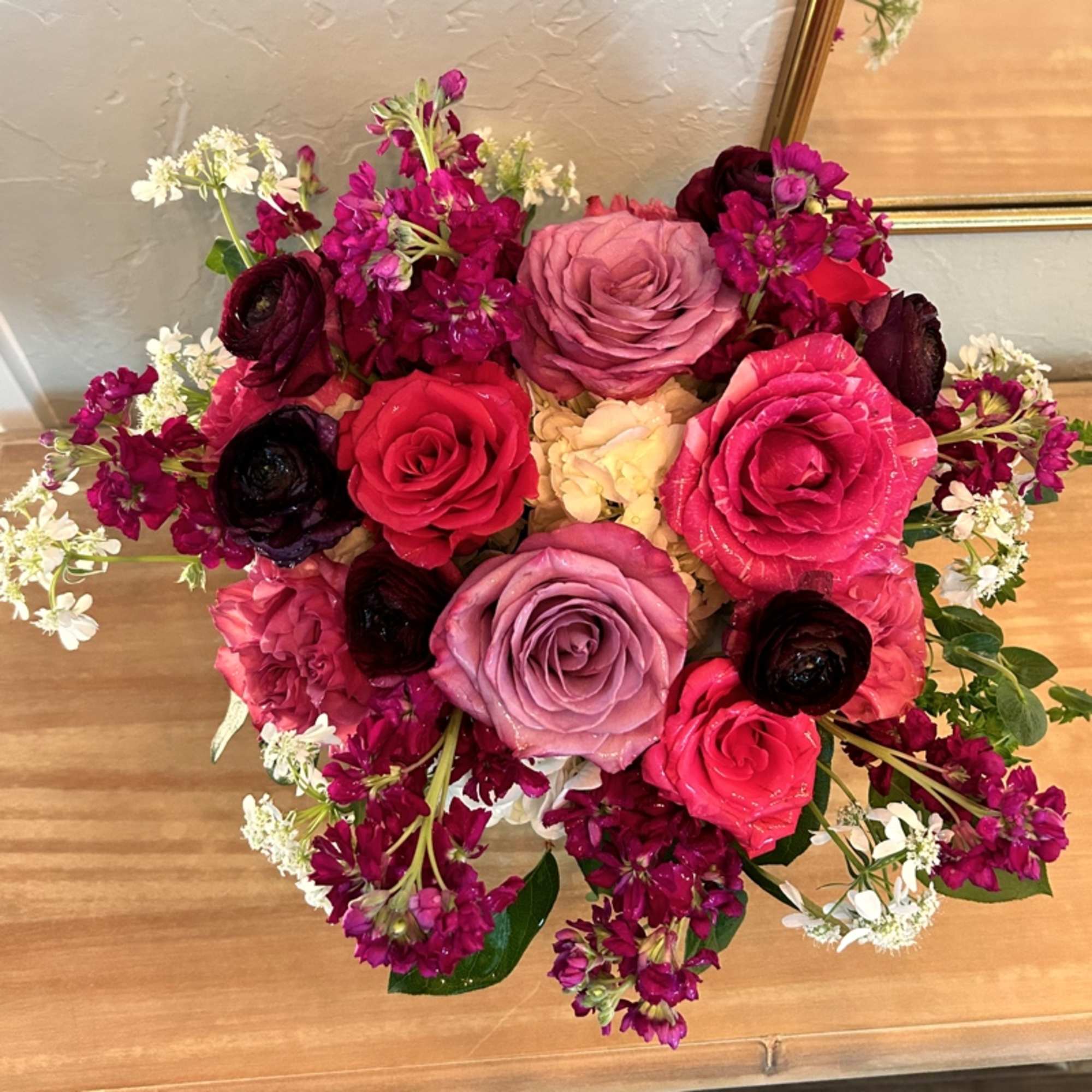 Elegant Emily is a colorful mix of roses, ranunculus, stock and hydrangea