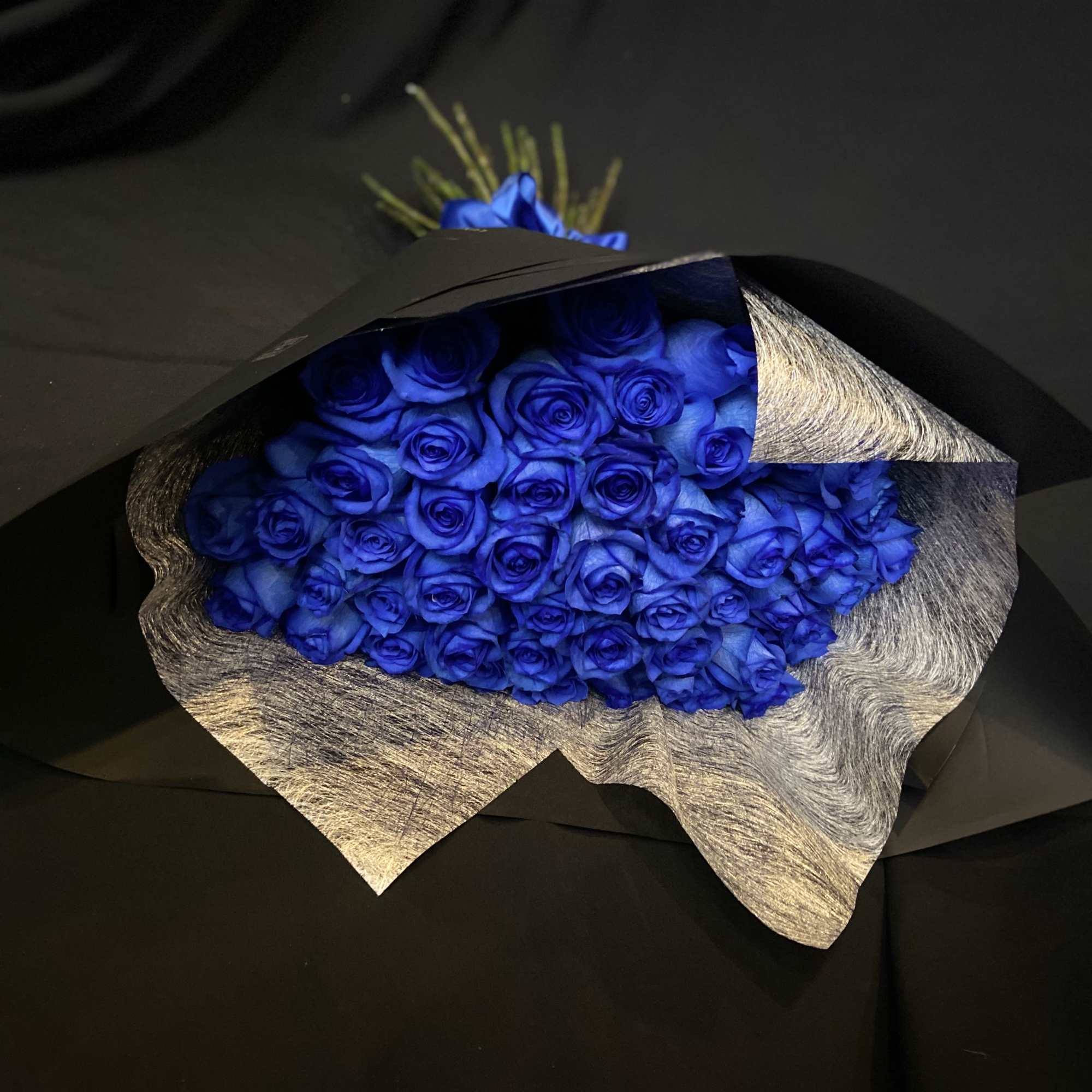 50 Beautiful Blue Roses, Wrapped with Black Paper.