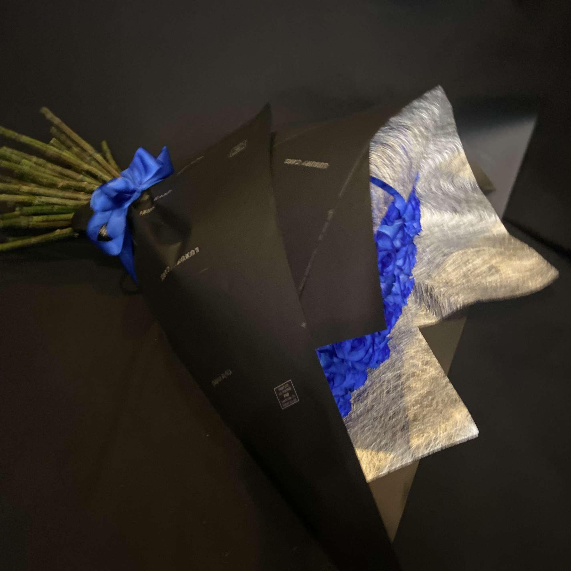 50 Beautiful Blue Roses, Wrapped with Black Paper.