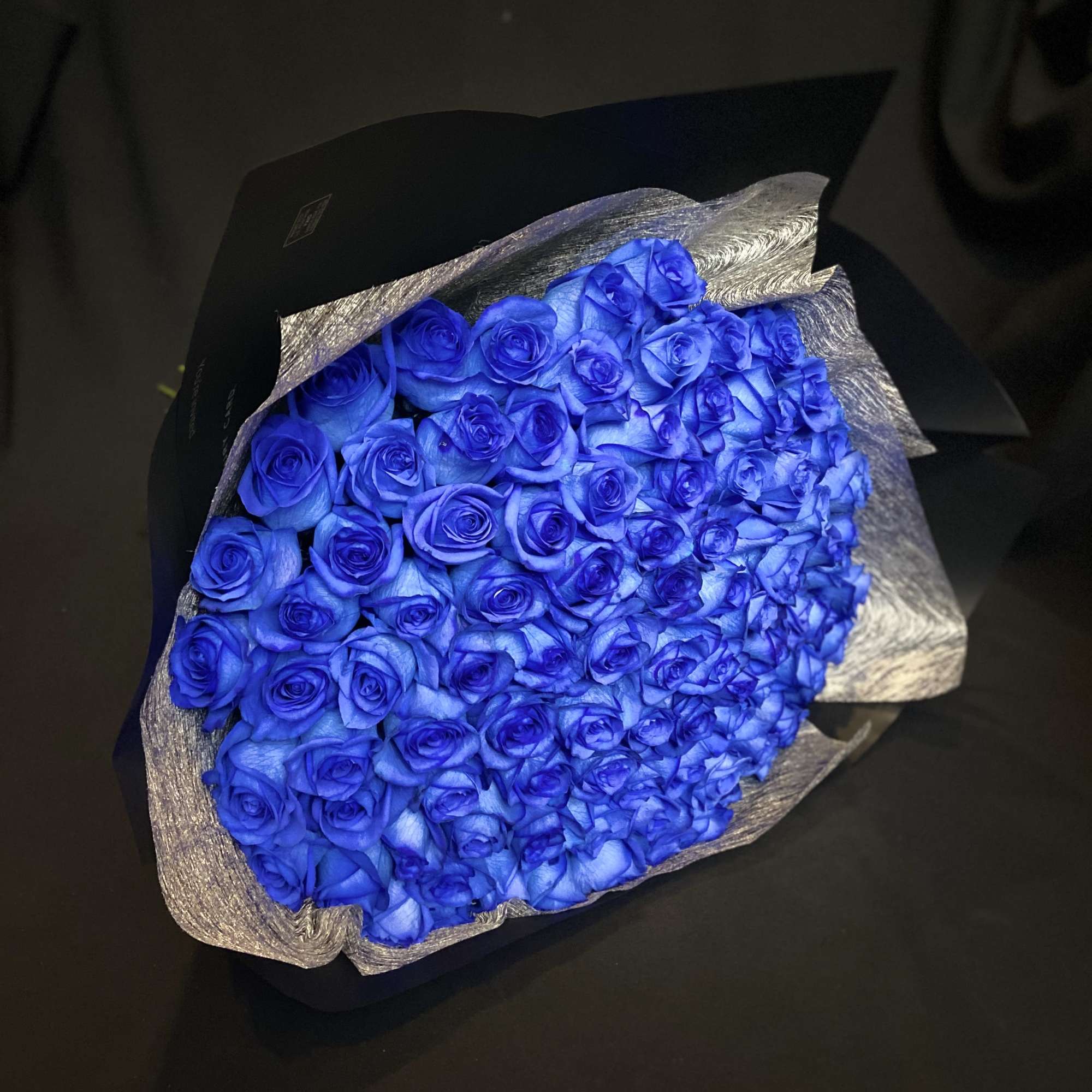 50 Beautiful Blue Roses, Wrapped with Black Paper.