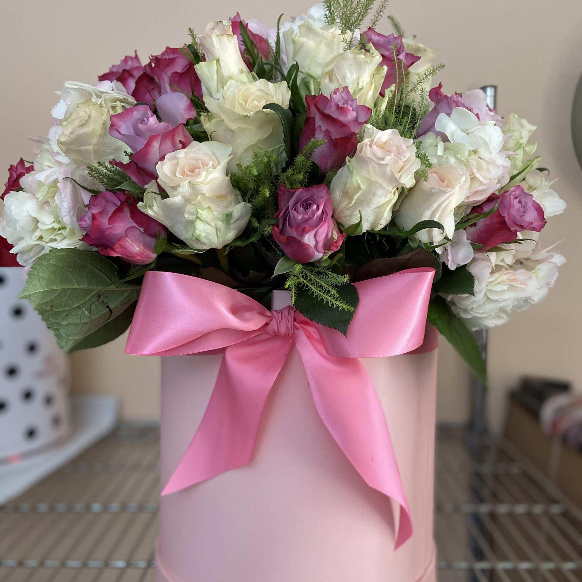 Cylinder Box with 12 Lavender, 12 Ivory Roses, and hydrangeas.