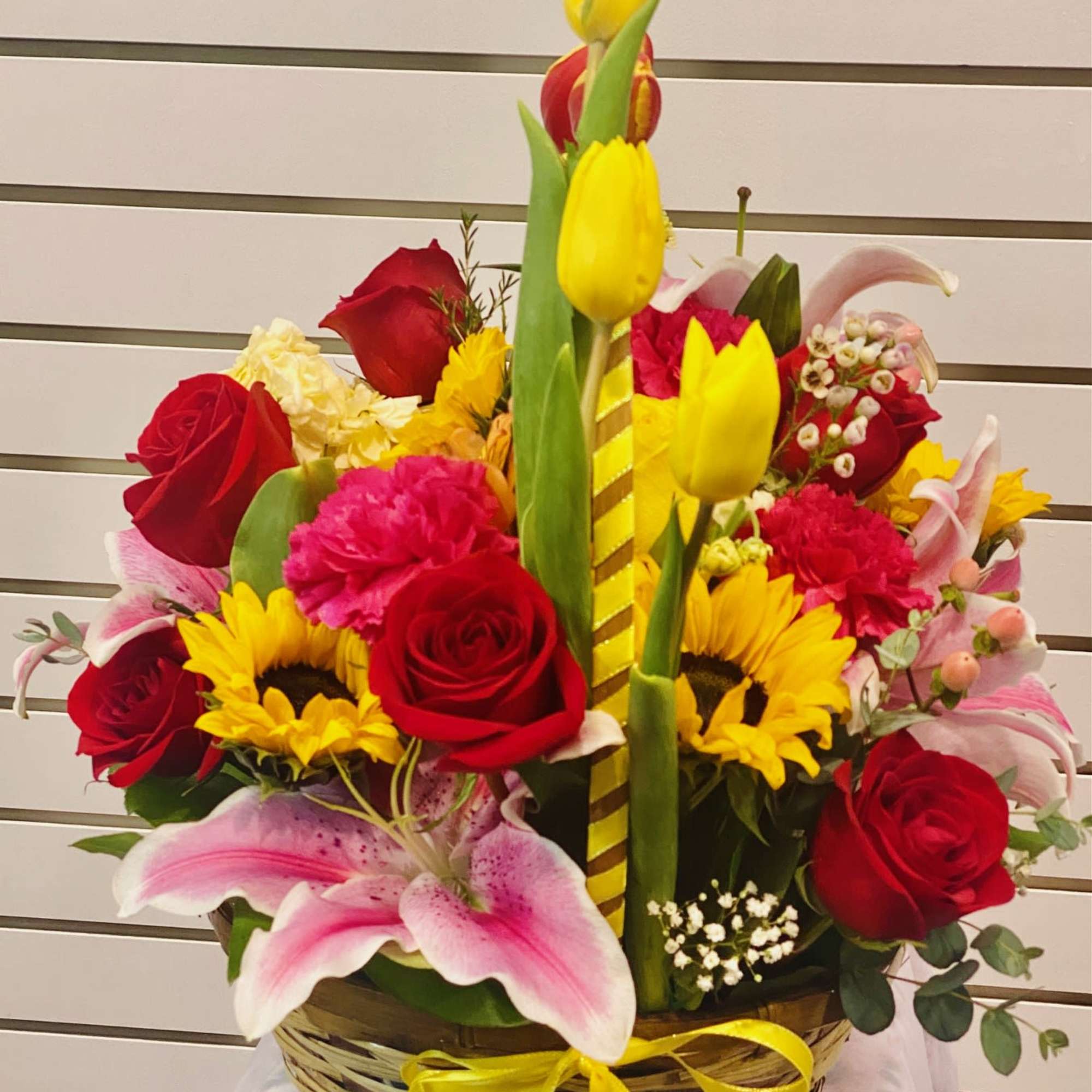 Featuring lilies, tulips, roses, Sunflower, carnation, and more in a Bright and