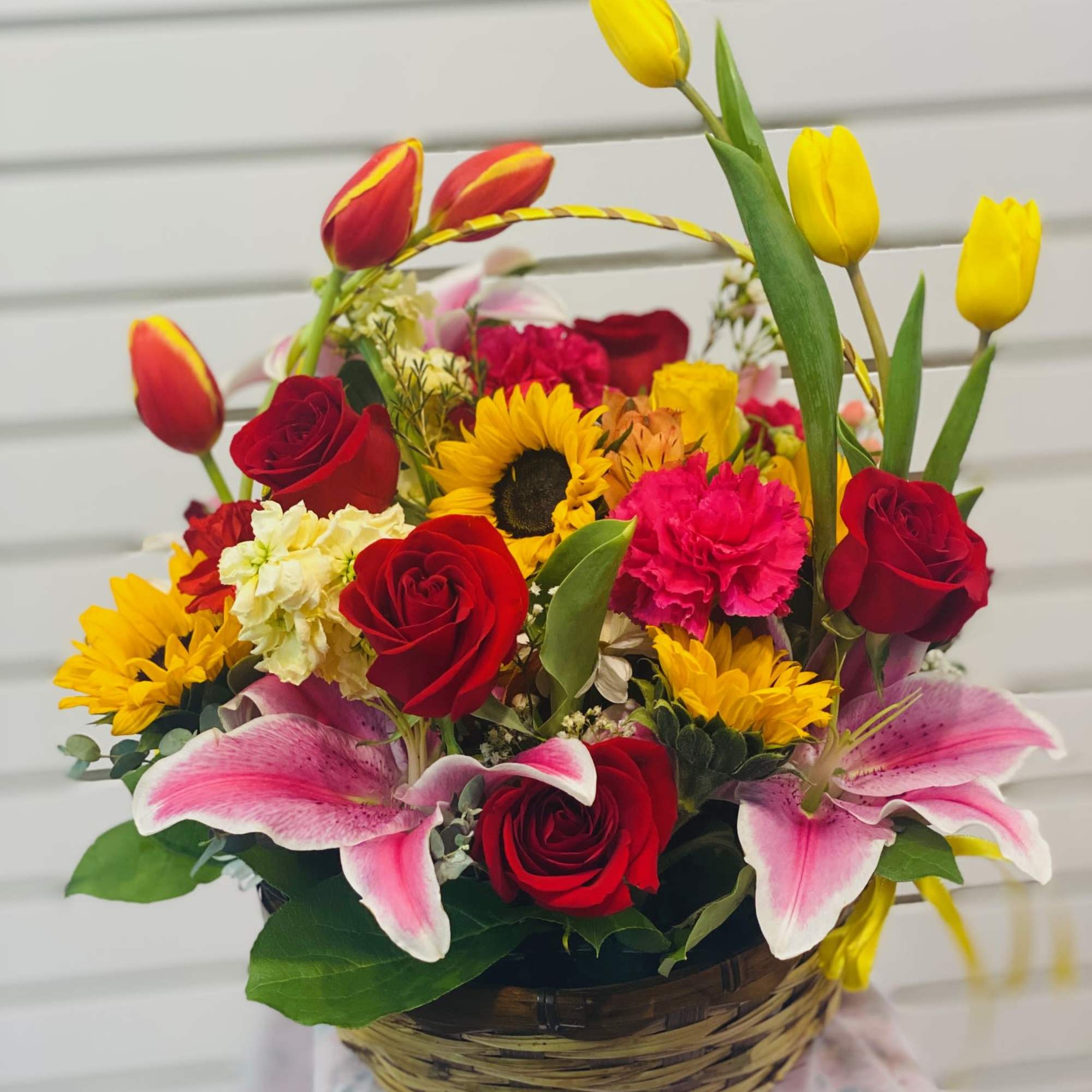 Featuring lilies, tulips, roses, Sunflower, carnation, and more in a Bright and