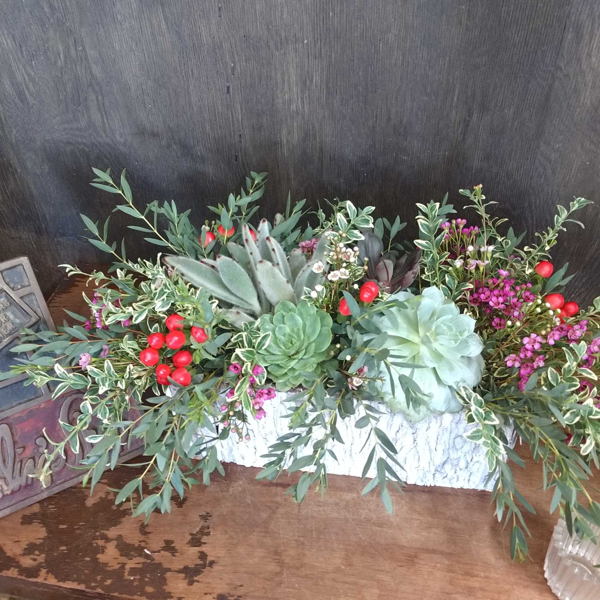 Beautiful assortment of succulents &amp; greenery. In a rectangular container. Container may