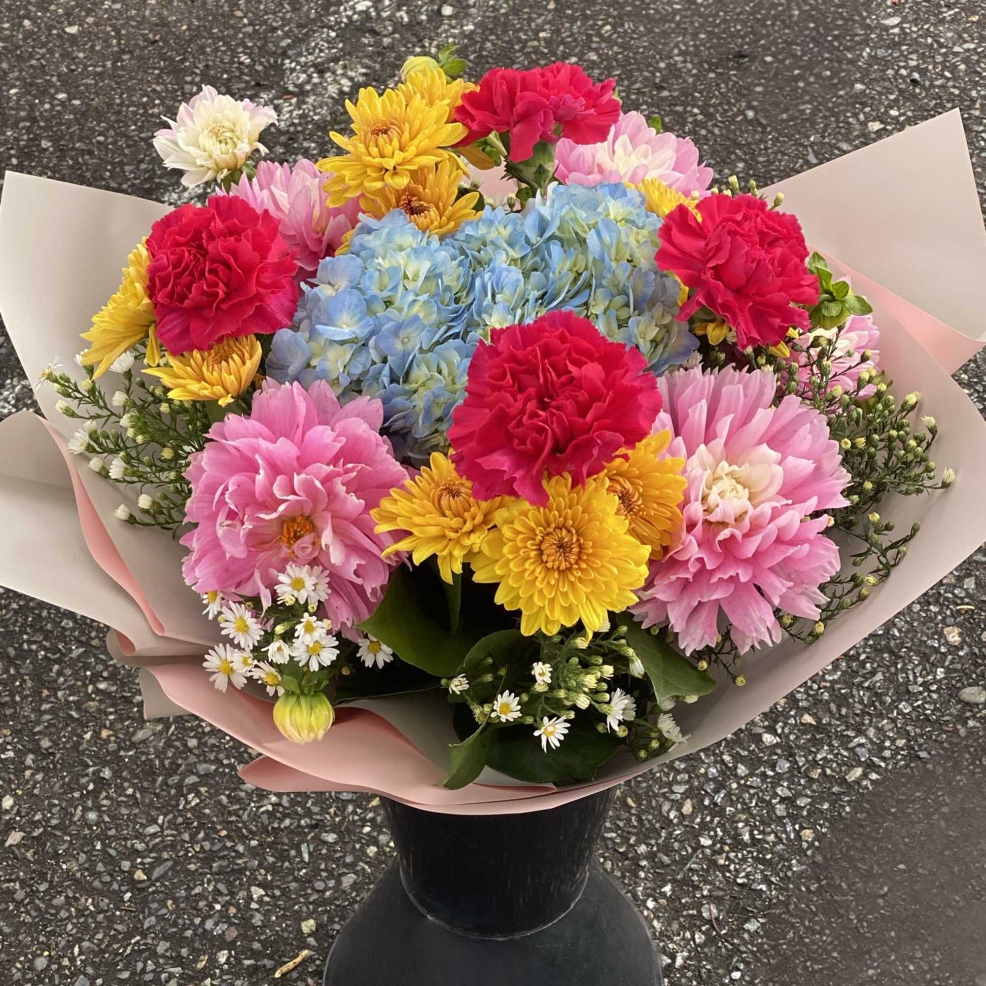 An artistic and bright multi color arrangement is a pleaser and interesting