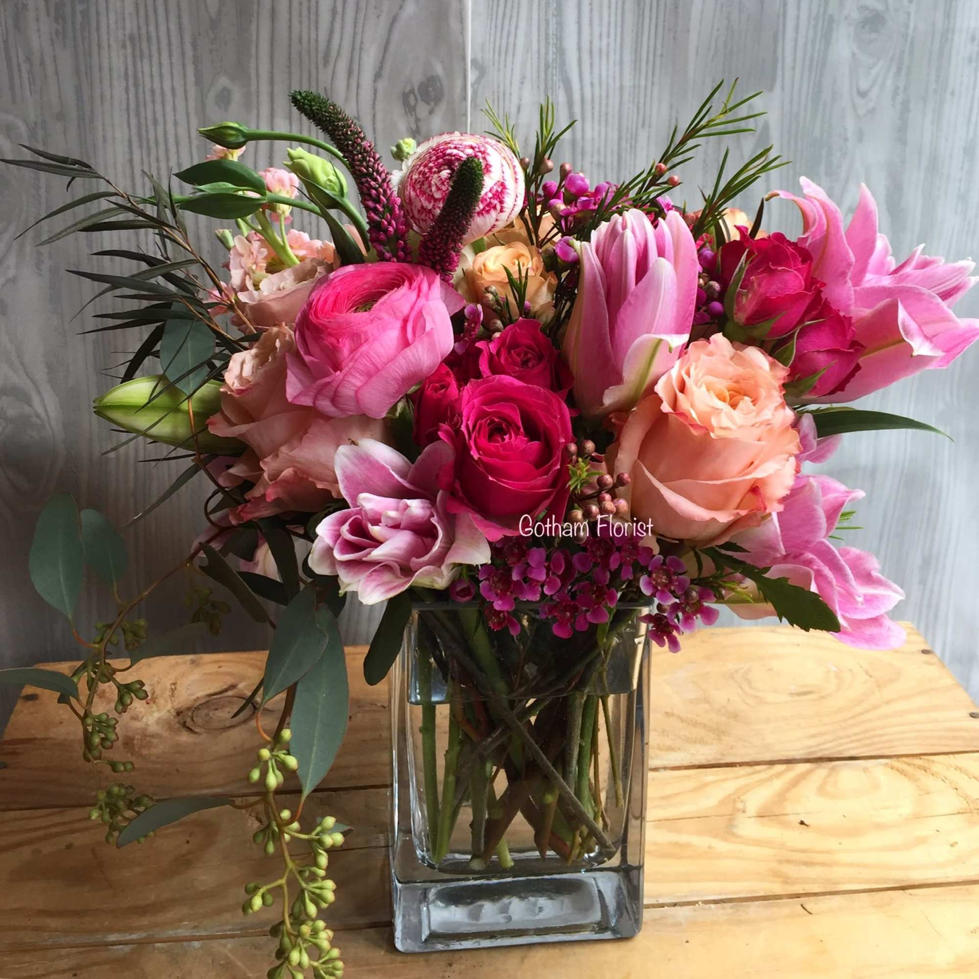 Hot pink roses with orchids and ranunculus. As Paris once said &quot;that&#039;s