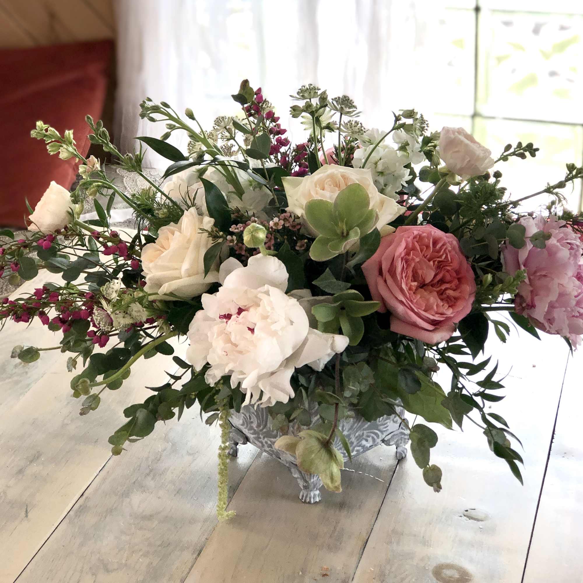 An elegant garden design with premium floral blooms, like Garden Roses, Peonies An elegant garden design with premium floral blooms, like Garden Roses, Peonies