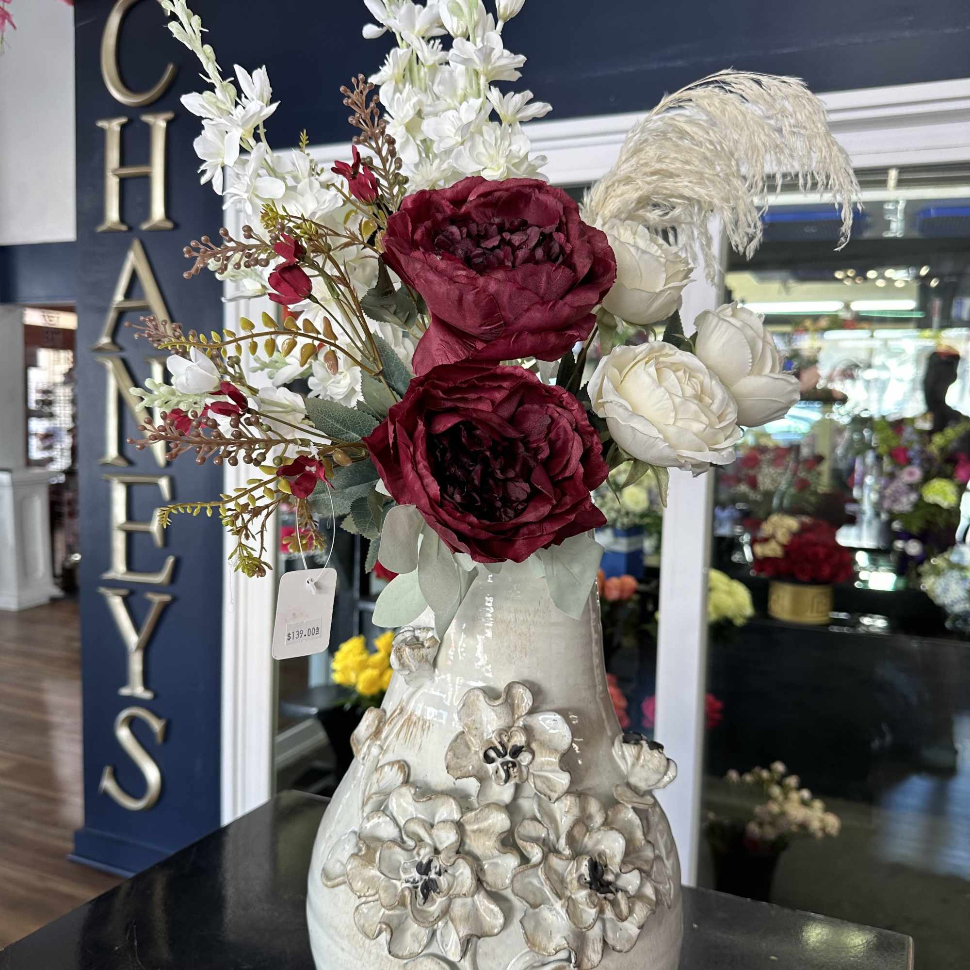 Unique piece! 30&ldquo; tall artificials hand arranged by our designers. Order before